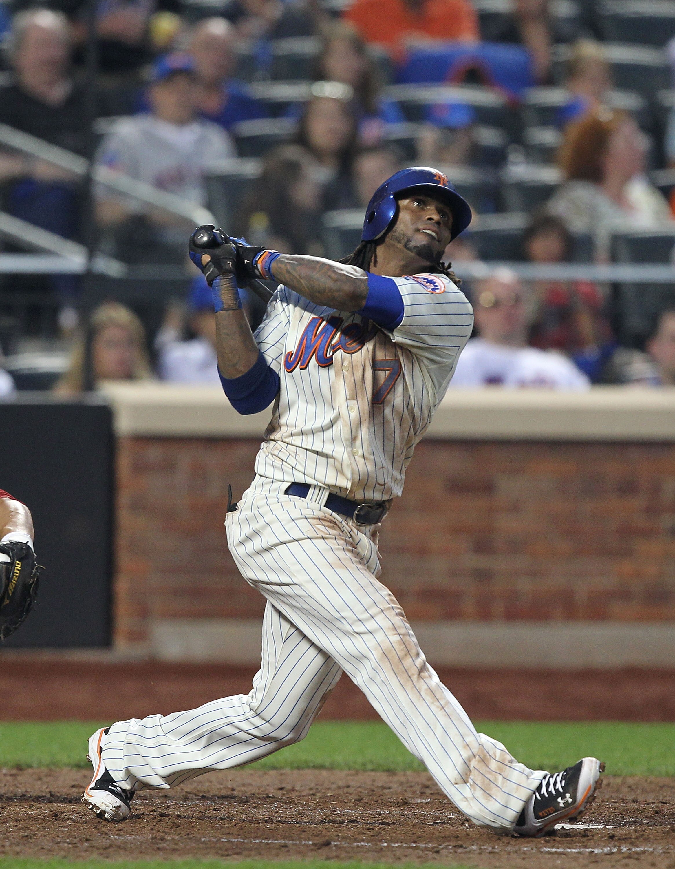 NEW YORK, NY - JUNE 18:  Jose Reyes #7 of the New York Mets hits a single against the Los Angeles Angels of Anaheim during their game on June 18, 2011 at Citi Field in the Flushing neighborhood of the Queens borough of New York City.  (Photo by Al Bello/G