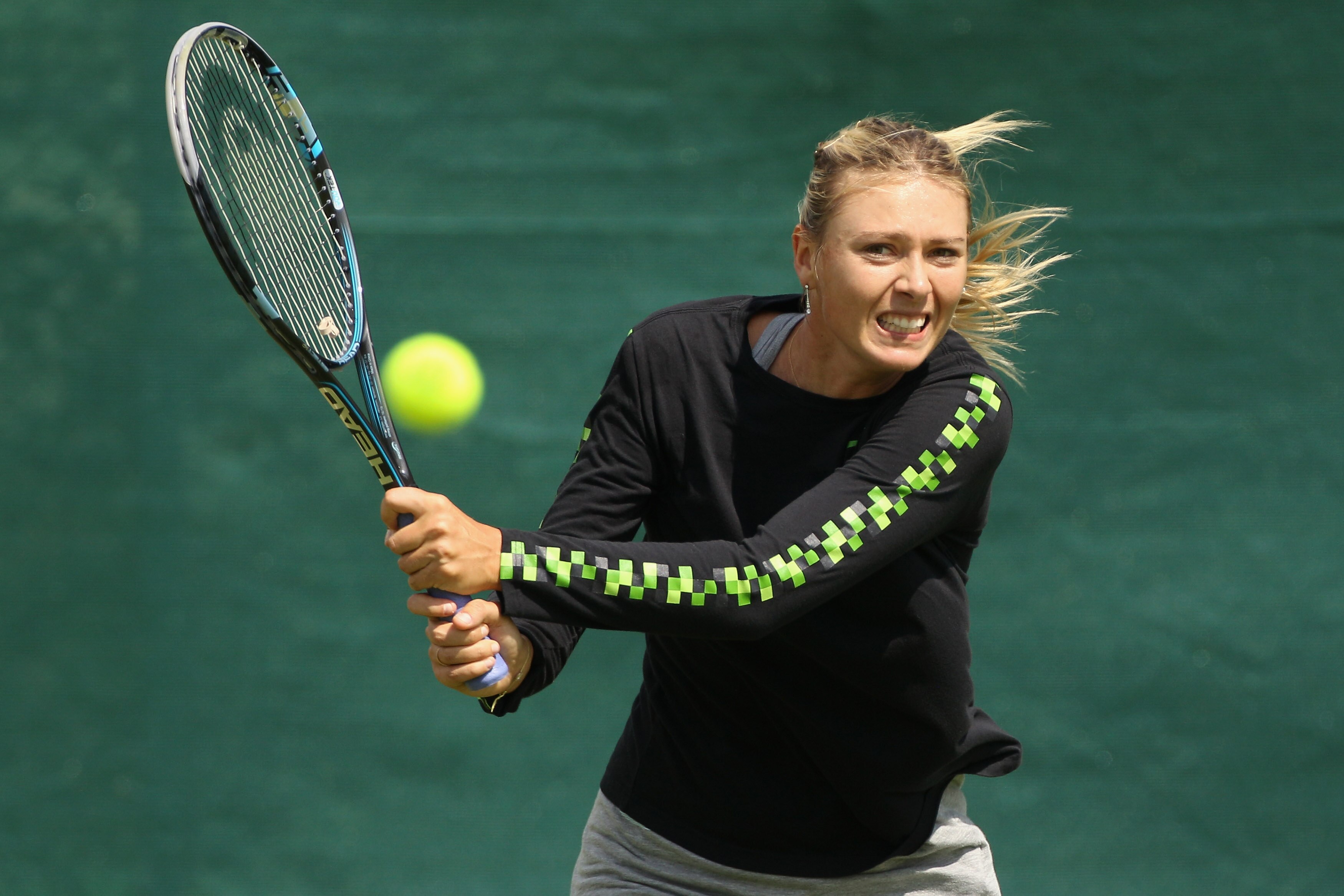 WIMBLEDON, ENGLAND - JUNE 18:  Maria Sharapova of Russia trains on the Aorangi Practice court at the All England Lawn Tennis and Croquet Club ahead of the Wimbledon Lawn Tennis Championships on June 18, 2011 in London, England. The Championships, which ar