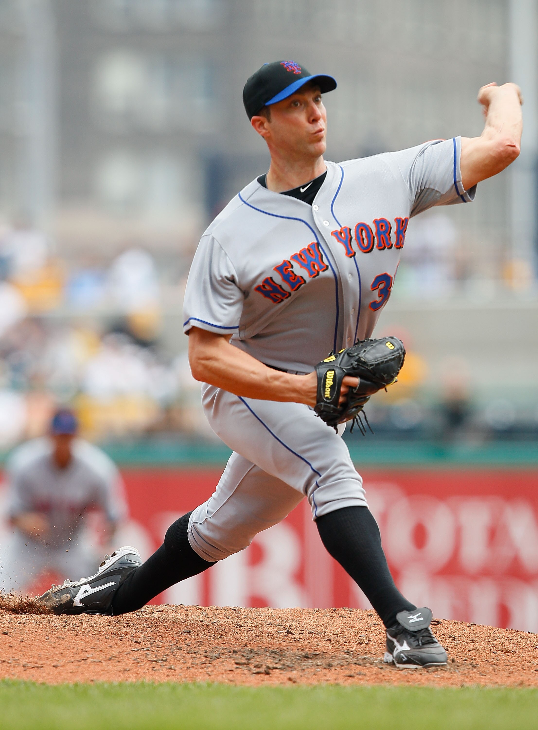 PITTSBURGH - JUNE 12:  Chris Capuano #38 of the New York Mets pitches against the Pittsburgh Pirates during the game on June 12, 2011 at PNC Park in Pittsburgh, Pennsylvania.  (Photo by Jared Wickerham/Getty Images)
