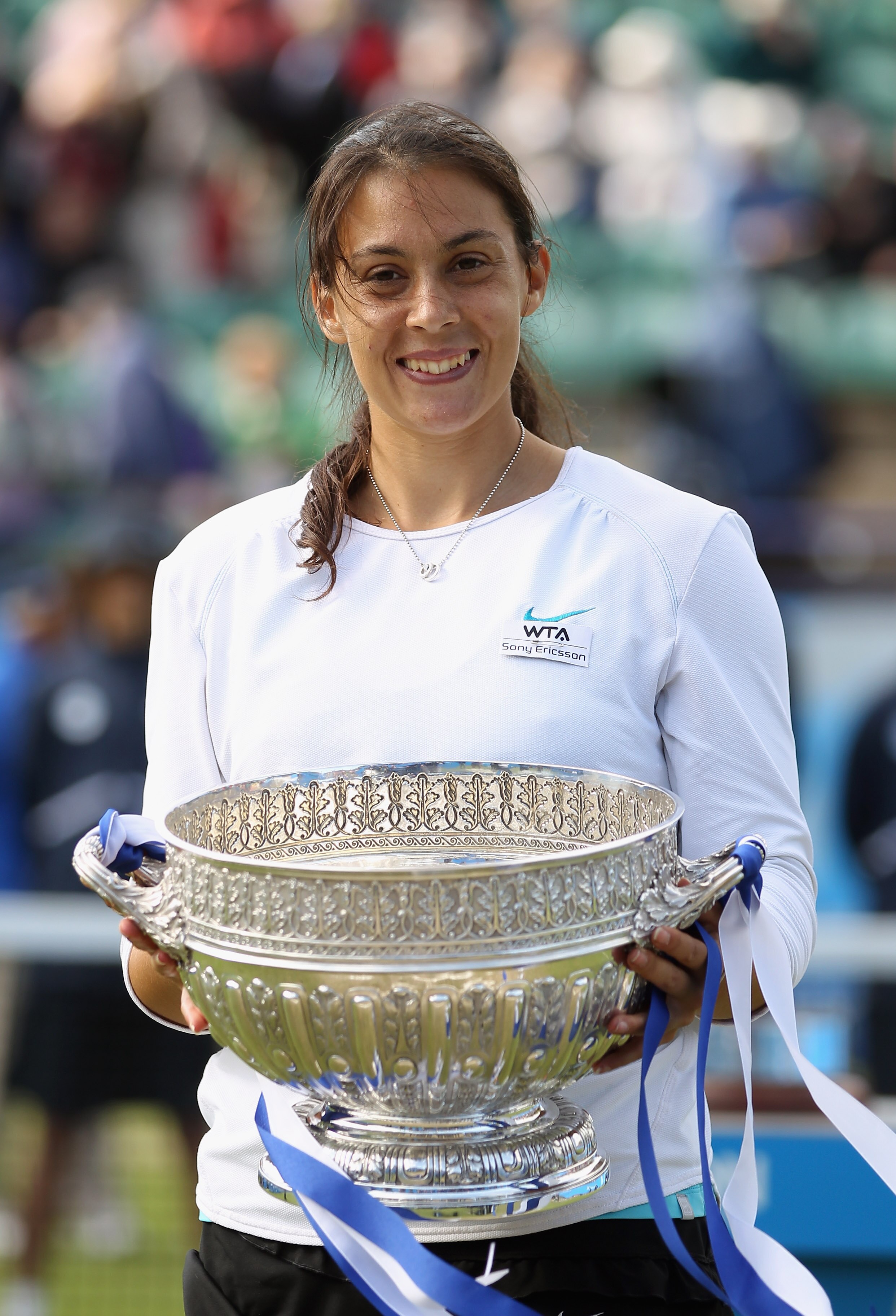 EASTBOURNE, ENGLAND - JUNE 18:  Marion Bartoli of France lifts the trophy to celebrate winning the WTA Singles Final against Petra Kvitova of the Czech Republic on day eight of the AEGON International at Devonshire Park on June 18, 2011 in Eastbourne, Eng