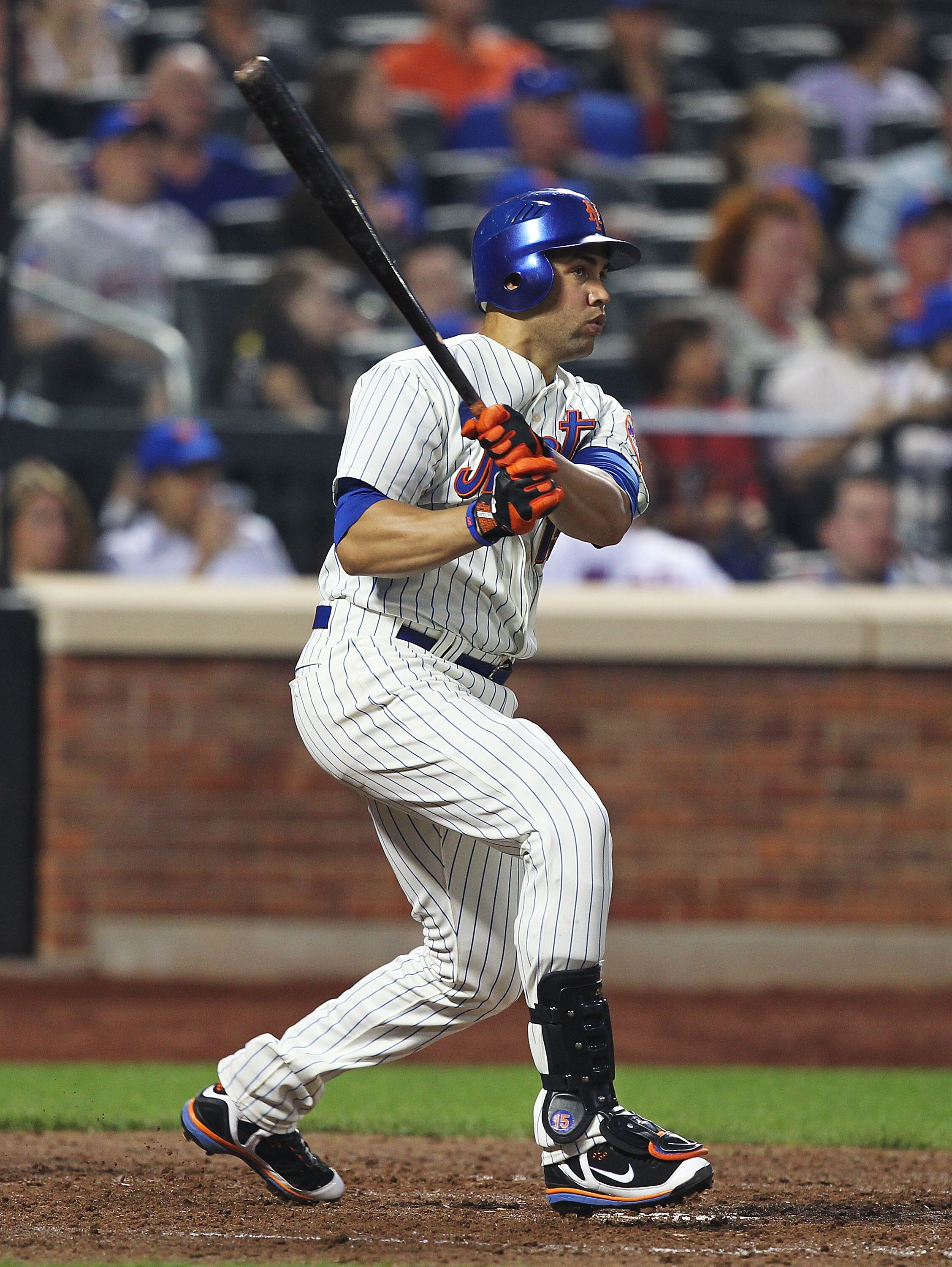 NEW YORK, NY - JUNE 18:  Carlos Beltran #15 of the New York Mets hits a two run home run in the fifth inning against the Los Angeles Angels of Anaheim during their game on June 18, 2011 at Citi Field in the Flushing neighborhood of the Queens borough of N