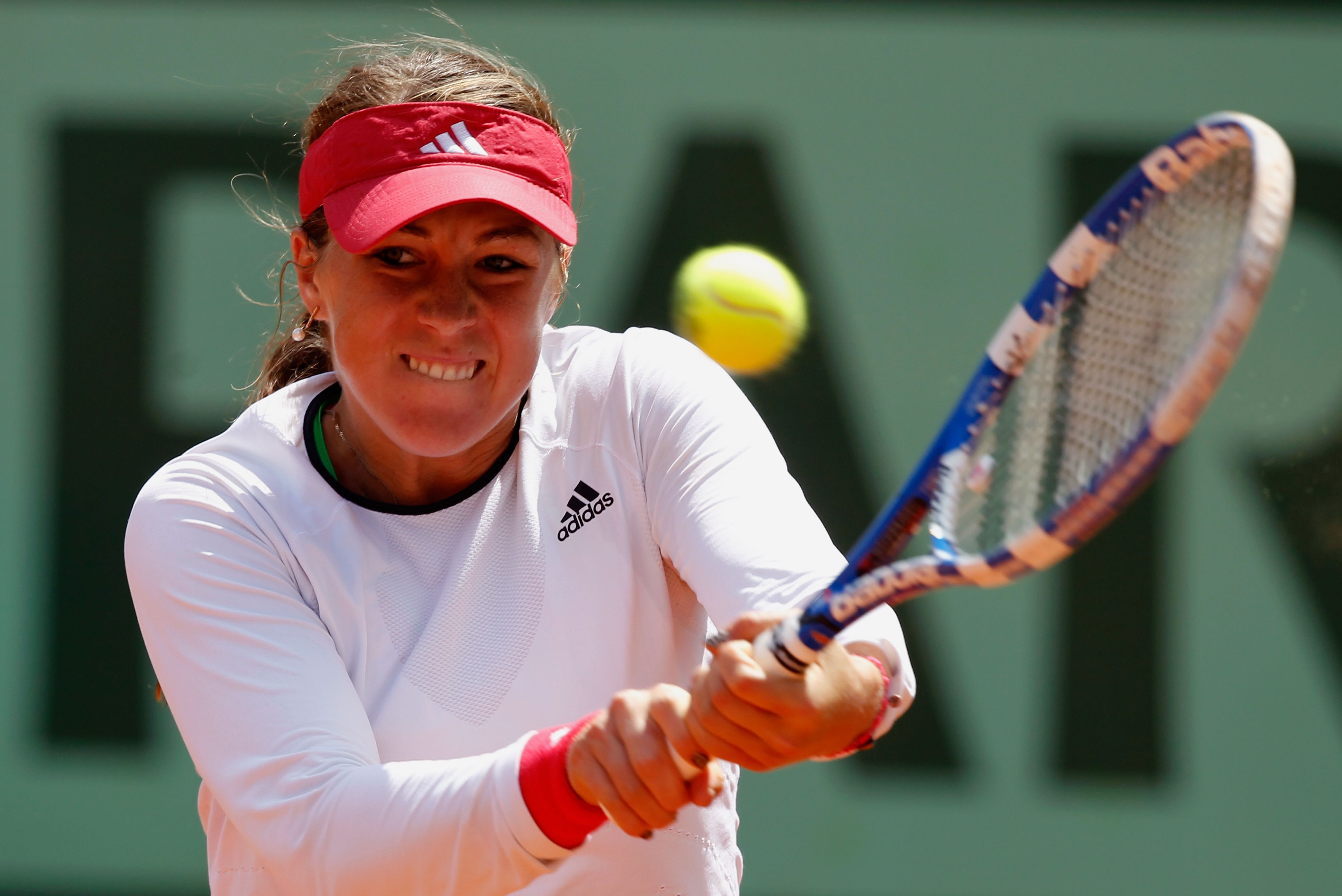 PARIS, FRANCE - MAY 31:  Anastasia Pavlyuchenkova of Russia plays a backhand during the women's singles quarterfinal match between Anastasia Pavlyuchenkova of Russia and Francesca Schiavone of Italy on day ten of the French Open at Roland Garros on May 31