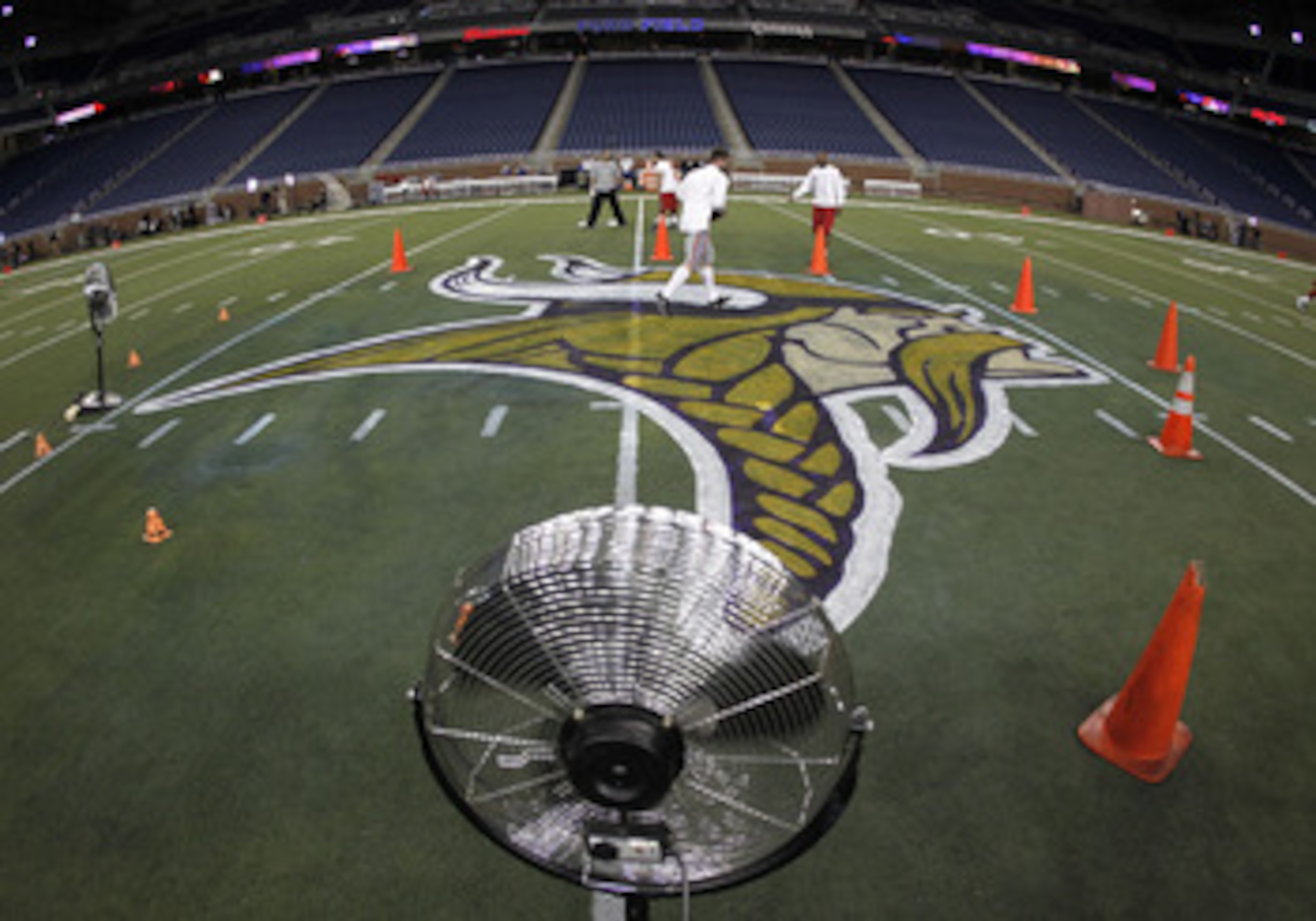 DETROIT, MI - DECEMBER 13: Fans dry new logos painted on the field prior to the Minnesota Vikings playing the New York Giants at Ford Field on December 13, 2010 in Detroit, Michigan. (Photo by Gregory Shamus/Getty Images) DETROIT, MI - DECEMBER 13: Fans dry new logos painted on the field prior to the Minnesota Vikings playing the New York Giants at Ford Field on December 13, 2010 in Detroit, Michigan. (Photo by Gregory Shamus/Getty Images)