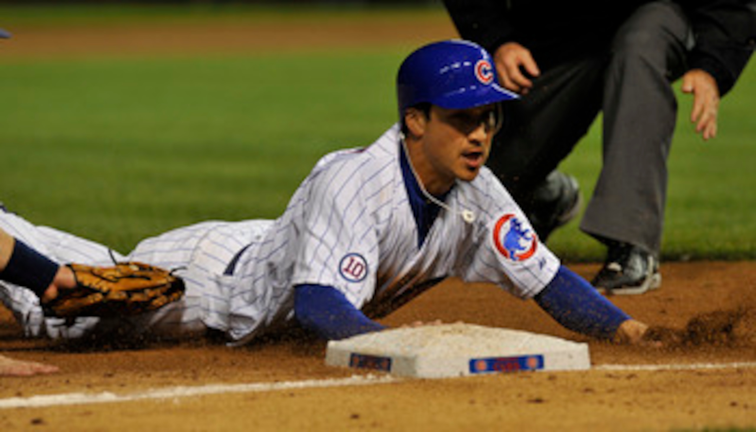 CHICAGO, IL - JUNE 13: Darwin Barney  # 15 of the Chicago Cubs slides into third base against the Milwaukee Brewers on June 13, 2011 at Wrigley Field in Chicago, Illinois. The Cubs defeated the Brewers 1-0.  (Photo by David Banks/Getty Images)
