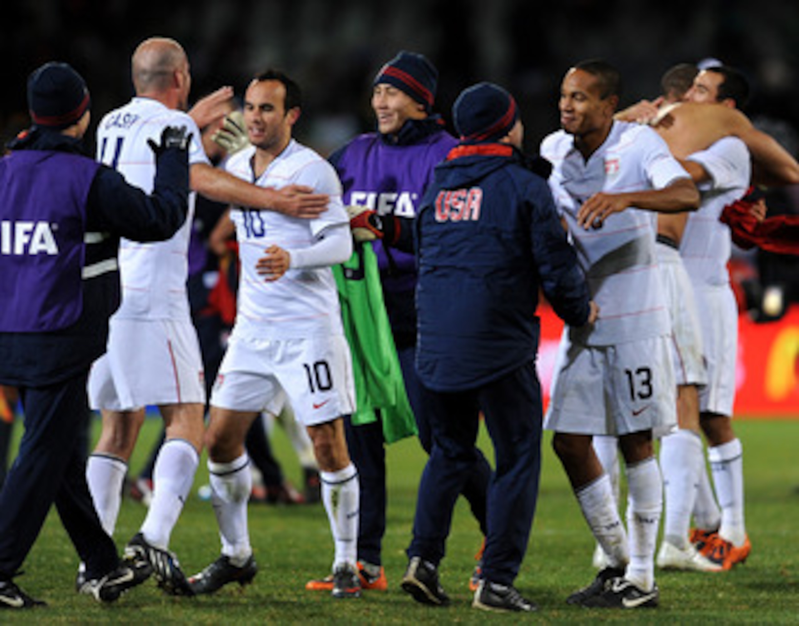 BLOEMFONTEIN, SOUTH AFRICA - JUNE 24: Ricardo Clark (#13) and Landon Donovan (#10) of USA celebrate victory with teammates and substitutes at the end of the FIFA Confederations Cup Semi Final match against Spain at Free State Stadium on June 24, 2009 in BLOEMFONTEIN, SOUTH AFRICA - JUNE 24: Ricardo Clark (#13) and Landon Donovan (#10) of USA celebrate victory with teammates and substitutes at the end of the FIFA Confederations Cup Semi Final match against Spain at Free State Stadium on June 24, 2009 in