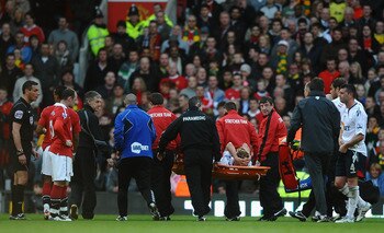 MANCHESTER, ENGLAND - MARCH 19: Stuart Holden of Bolton Wanders is stretchered off injured during the Barclays Premier League match between Manchester United and Bolton Wanderers at Old Trafford on March 19, 2011 in Manchester, England.  (Photo by Laurenc