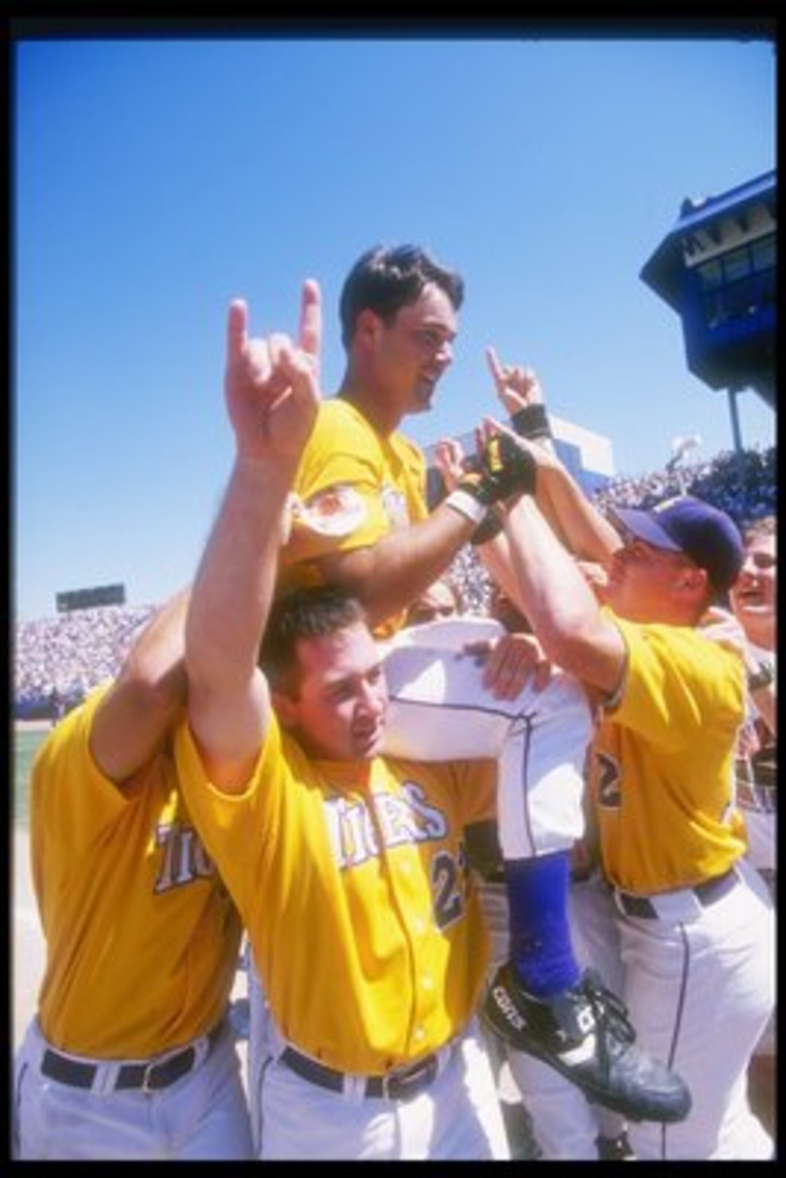 8 Jun 1996: Warren Morris of the Miami Hurricanes rides on top of his teammates after winning a playoff game against the Louisville Cardinals at Rosenblatt Stadium in Omaha, Nebraska. The Hurricanes won the game 8 - 3.