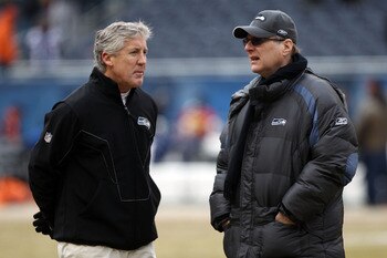 CHICAGO, IL - JANUARY 16:  (L-R) Head coach Pete Carroll of the Seattle Seahawks talks with Seahawks team owner Paul Allen before the 2011 NFC divisional playoff game against the Chicago Bears at Soldier Field on January 16, 2011 in Chicago, Illinois.  (P