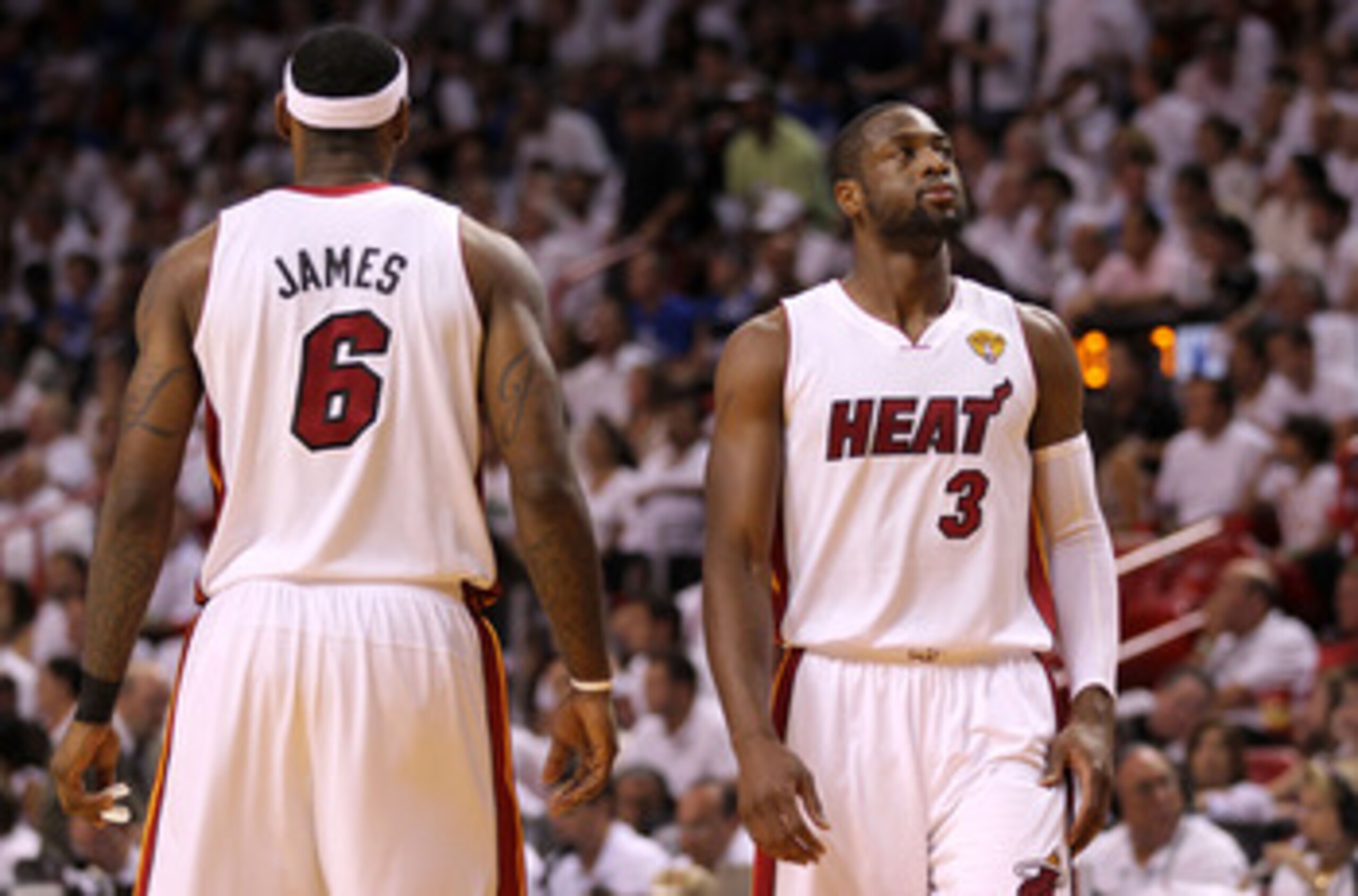 MIAMI, FL - JUNE 12:  Dwyane Wade #3 (R) and LeBron James #6 of the Miami Heat stand on court against the Dallas Mavericks in Game Six of the 2011 NBA Finals at American Airlines Arena on June 12, 2011 in Miami, Florida. NOTE TO USER: User expressly ackno