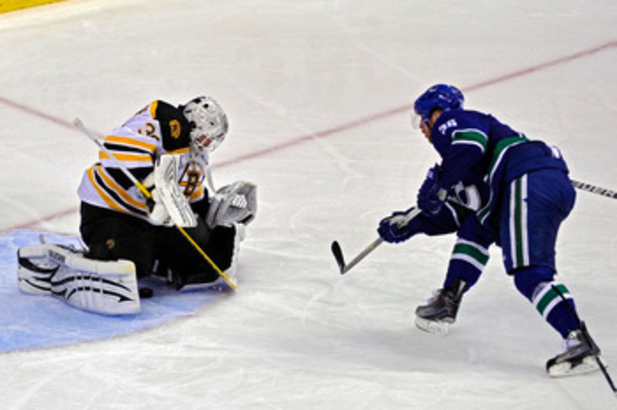VANCOUVER, BC - JUNE 01:  Tim Thomas #30 of the Boston Bruins makes a save against Jannik Hansen #36 of the Vancouver Canucks during game one of the 2011 NHL Stanley Cup Finals at Rogers Arena on June 1, 2011 in Vancouver, Canada.  (Photo by Rich Lam/Gett