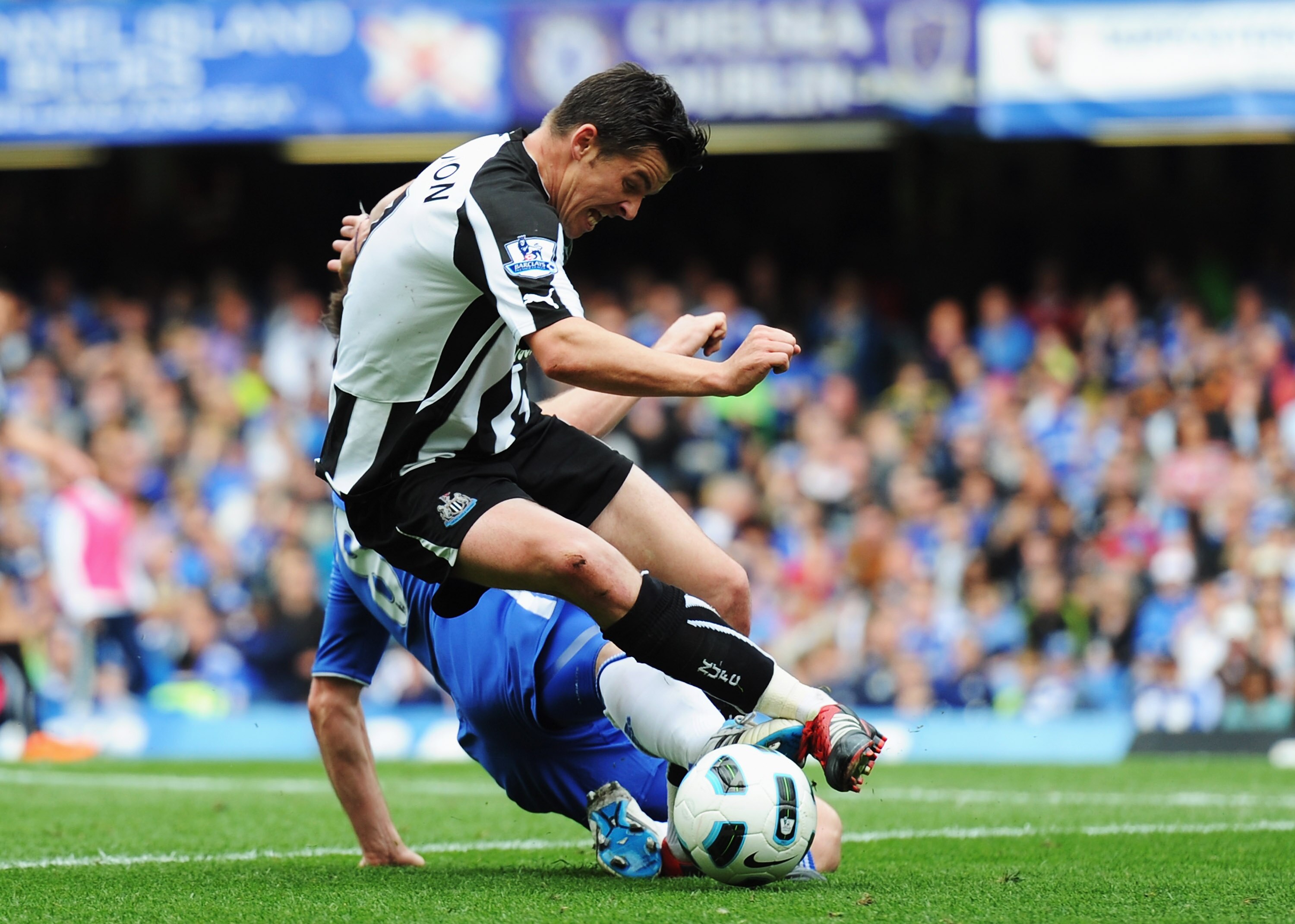 LONDON, ENGLAND - MAY 15:  Joey Barton (front) of Newcastle United is fouled by Frank Lampard of Chelsea during the Barclays Premier League match between Chelsea and Newcastle United at Stamford Bridge on May 15, 2011 in London, England.  (Photo by Michae
