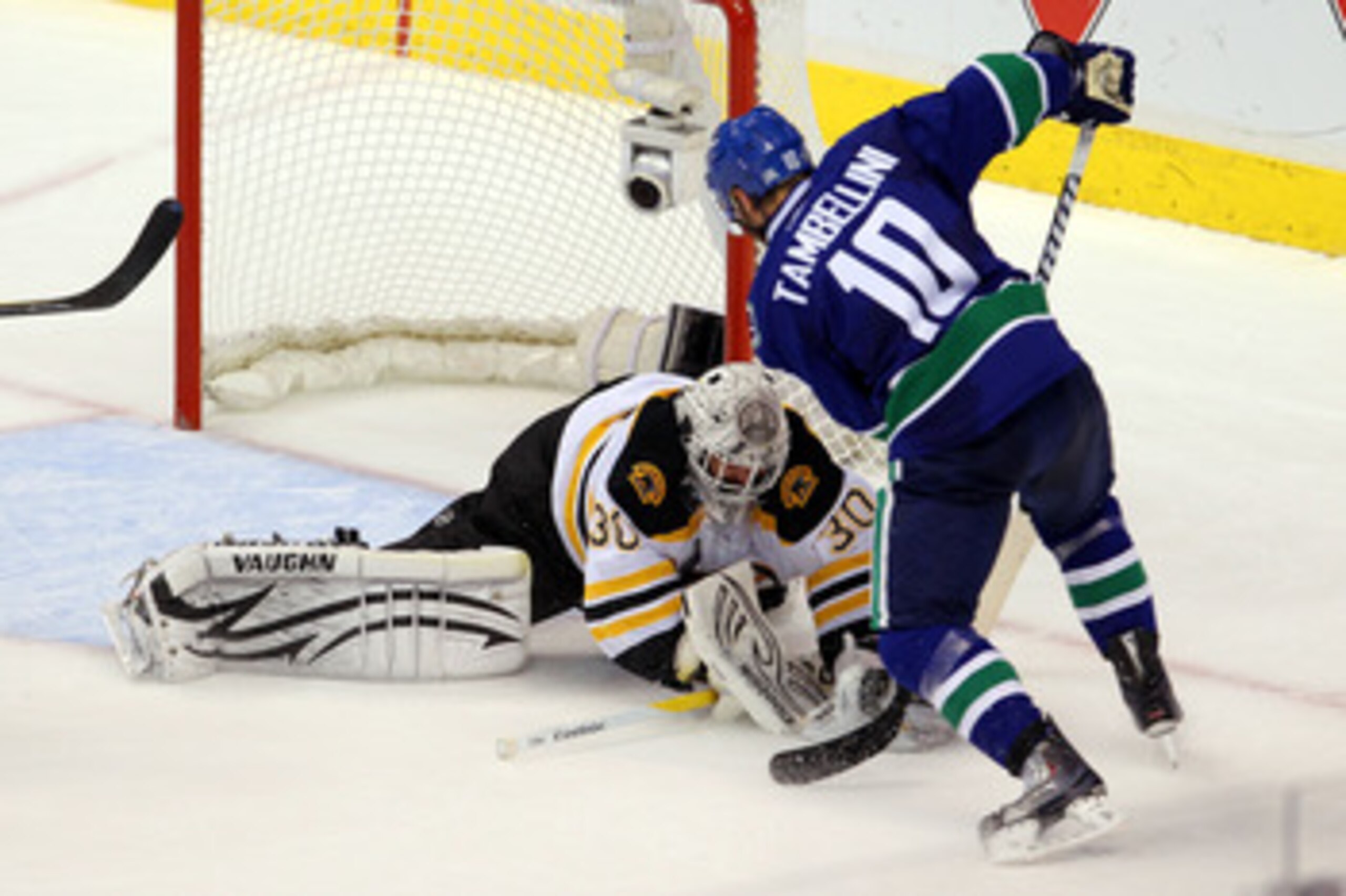 VANCOUVER, BC - JUNE 15:  Tim Thomas #30 of the Boston Bruins makes a save against Jeff Tambellini #10 of the Vancouver Canucks during Game Seven of the 2011 NHL Stanley Cup Final at Rogers Arena on June 15, 2011 in Vancouver, British Columbia, Canada.  (