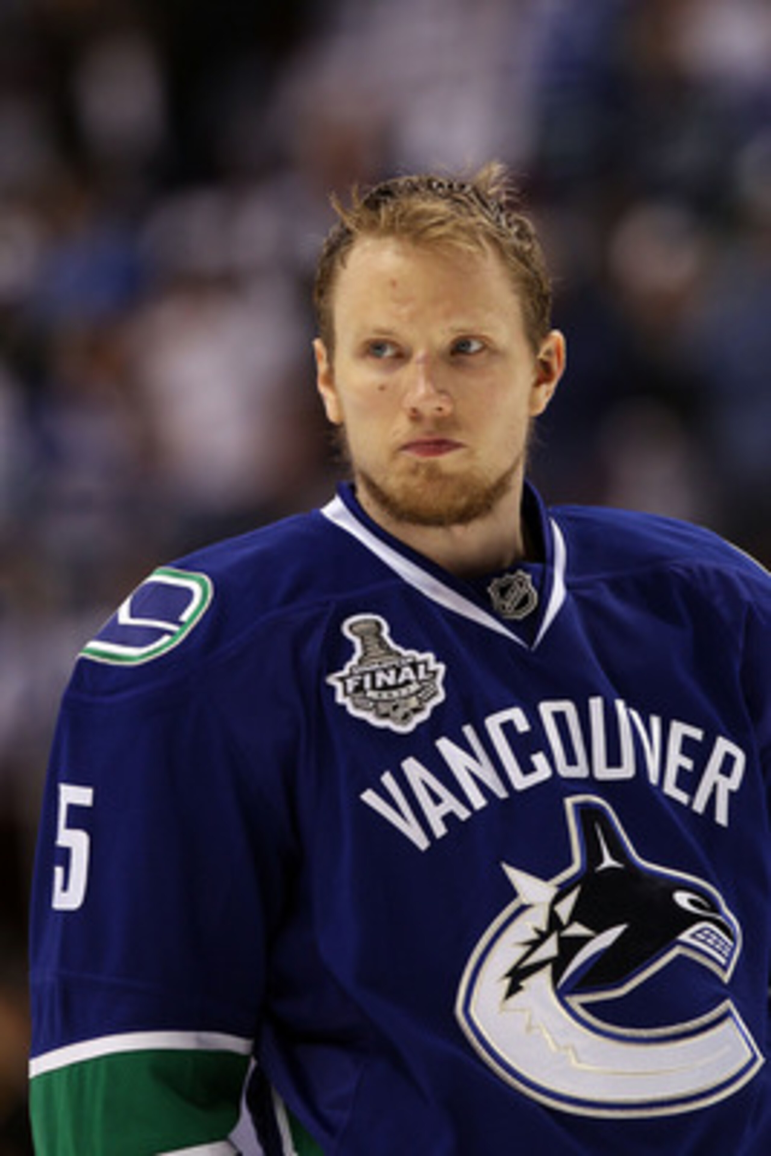 VANCOUVER, BC - JUNE 10:  Christian Ehrhoff #5 of the Vancouver Canucks looks on during Game Five of the 2011 NHL Stanley Cup Final at Rogers Arena on June 10, 2011 in Vancouver, British Columbia, Canada.  (Photo by Bruce Bennett/Getty Images)