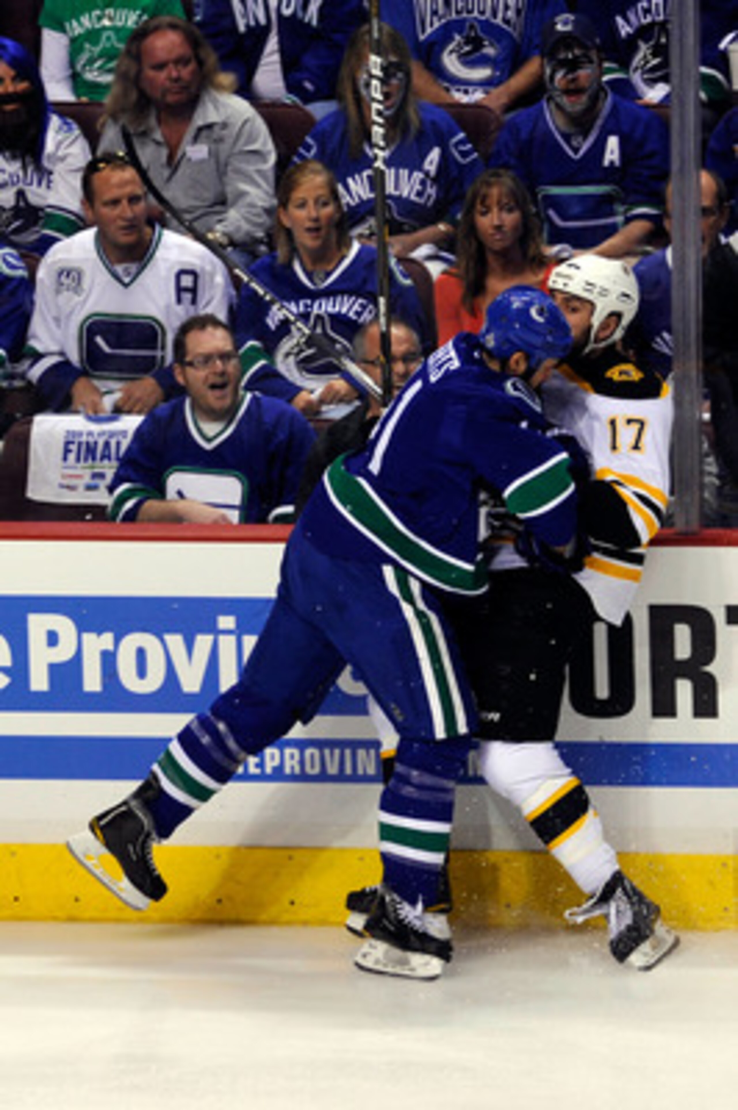 VANCOUVER, BC - JUNE 10:  Andrew Alberts #41 of the Vancouver Canucks checks Milan Lucic #17 of the Boston Bruins during Game Five of the 2011 NHL Stanley Cup Final at Rogers Arena on June 10, 2011 in Vancouver, British Columbia, Canada.  (Photo by Rich L