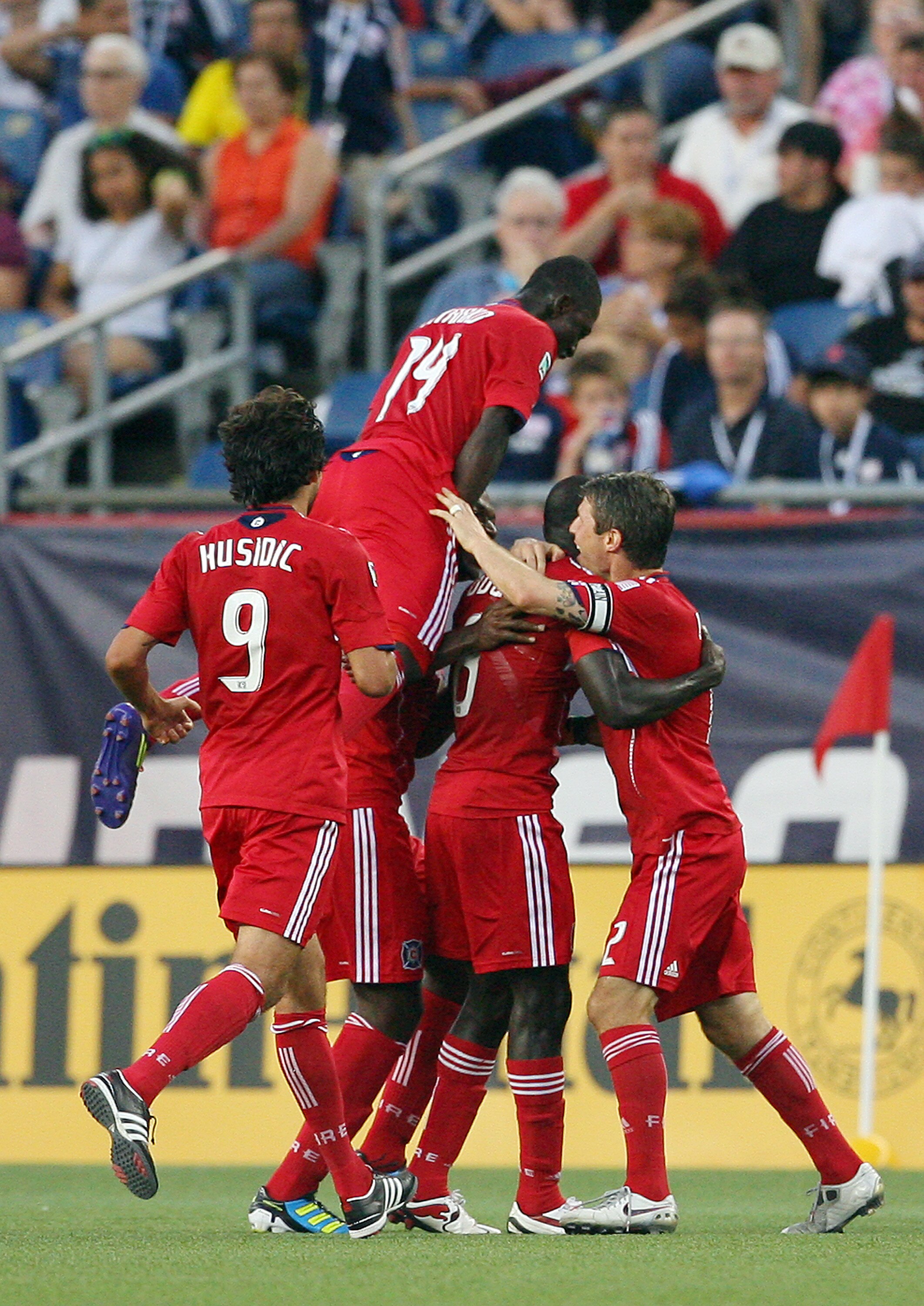 FOXBORO, MA - JUNE 18:  Patrick Nyarko #14 of the Chicago Fire celebrates with his teammates after Dominic Oduro #8 scored in a game against the New England Revolution at Gillette Stadium on June 18, 2011 in Foxboro, Massachusetts. (Photo by Gail Oskin/Ge
