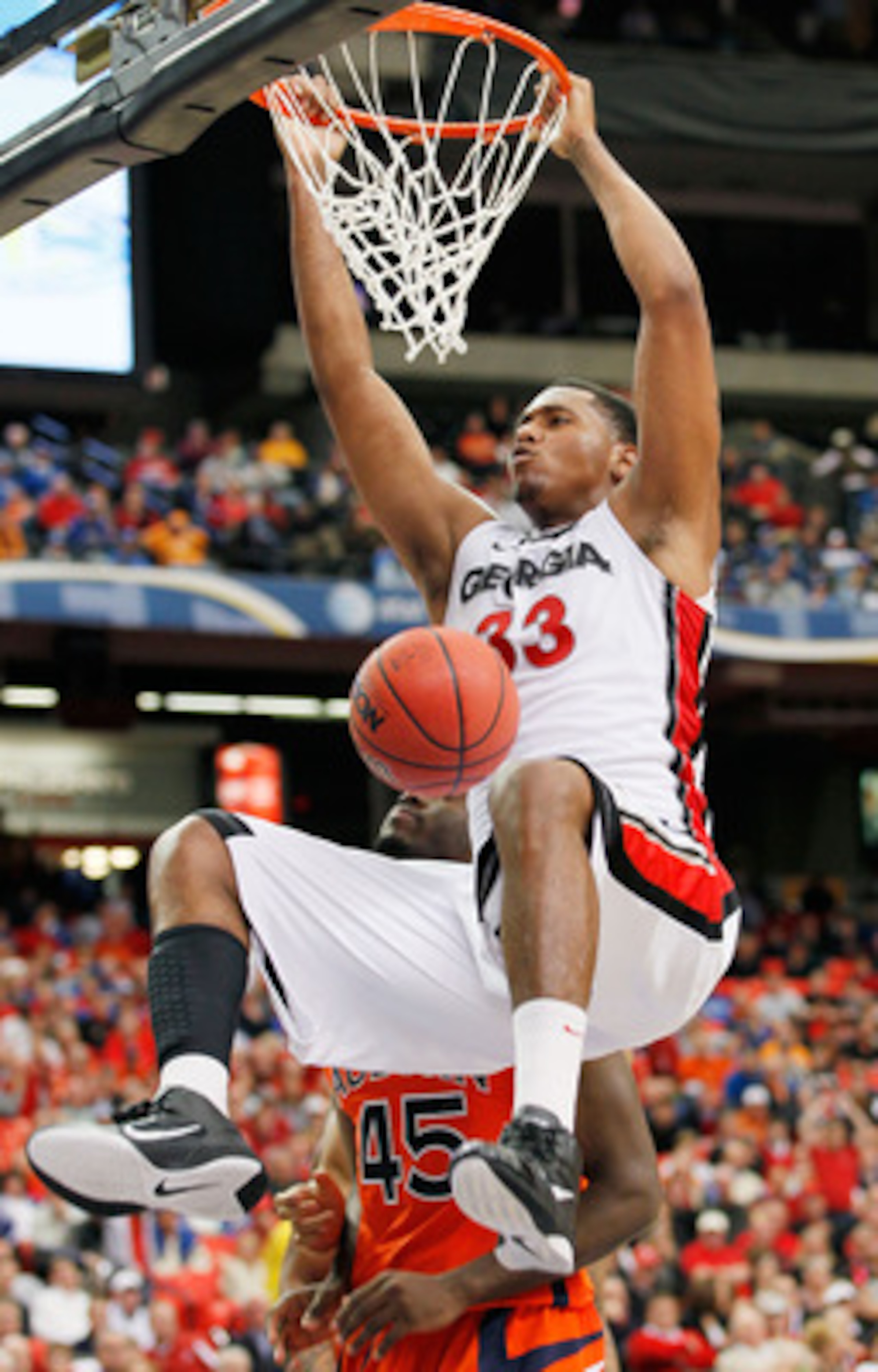 ATLANTA, GA - MARCH 10:  Trey Thompkins #33 of the Georgia Bulldogs dunks against the Auburn Tigers during the first round of the SEC Men's Basketball Tournament at the Georgia Dome on March 10, 2011 in Atlanta, Georgia.  (Photo by Kevin C. Cox/Getty Imag