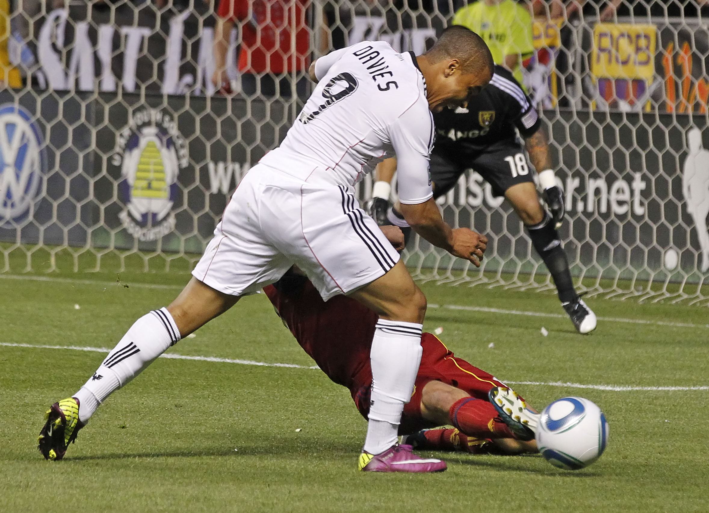 SANDY, UT - JUNE 18: Chris Wingert #17 of Real Salt Lake kicks the ball away from Charlie Davies #9 of DC United but was called for a penalty kick foul late in the second half of an MLS soccer game June 18, 2011 at Rio Tinto Stadium in Sandy, Utah. The pe