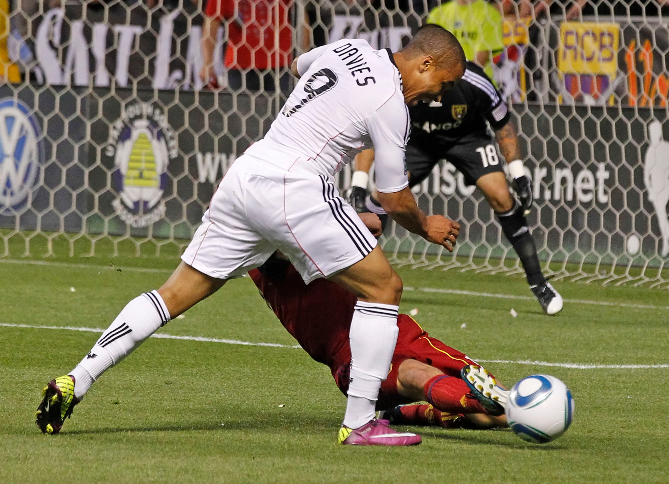 SANDY, UT - JUNE 18: Chris Wingert #17 of Real Salt Lake kicks the ball away from Charlie Davies #9 of DC United but was called for a penalty kick foul late in the second half of an MLS soccer game June 18, 2011 at Rio Tinto Stadium in Sandy, Utah. The pe