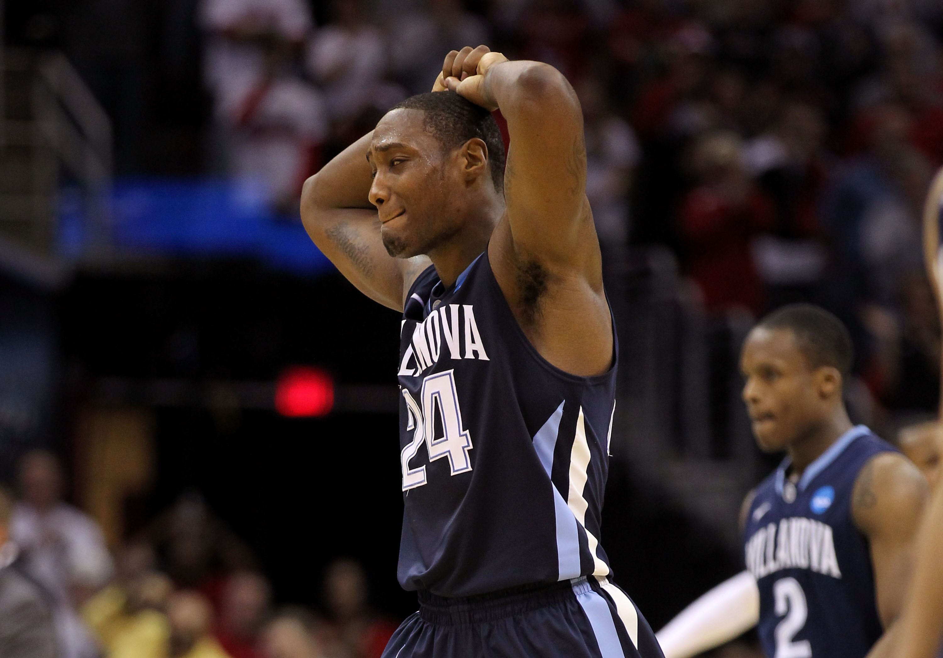 CLEVELAND, OH - MARCH 18: Corey Stokes #24 of the Villanova Wildcats walks off the court after being defeated by the George Mason Patriots during the second round of the 2011 NCAA men's basketball tournament at Quicken Loans Arena on March 18, 2011 in Cle