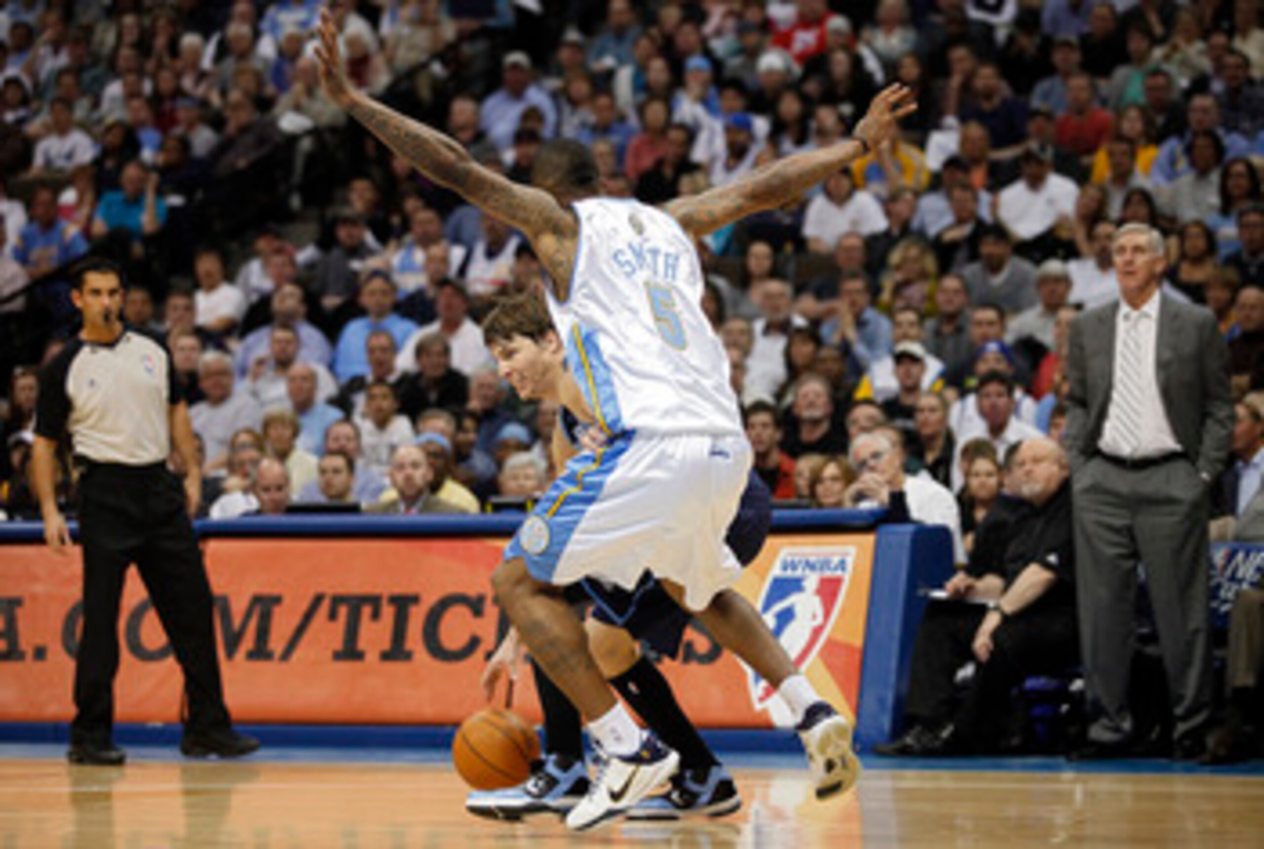 DENVER, CO - APRIL 17 : J.R. Smith #5 of the Denver Nuggets guards Kyle Korver #26 of the Utah Jazz as Korver tries to drive past Smith during the second half of Game One of the Western Conference Quarterfinals of the 2010 NBA Playoffs at the Pepsi Center DENVER, CO - APRIL 17 : J.R. Smith #5 of the Denver Nuggets guards Kyle Korver #26 of the Utah Jazz as Korver tries to drive past Smith during the second half of Game One of the Western Conference Quarterfinals of the 2010 NBA Playoffs at the Pepsi Center