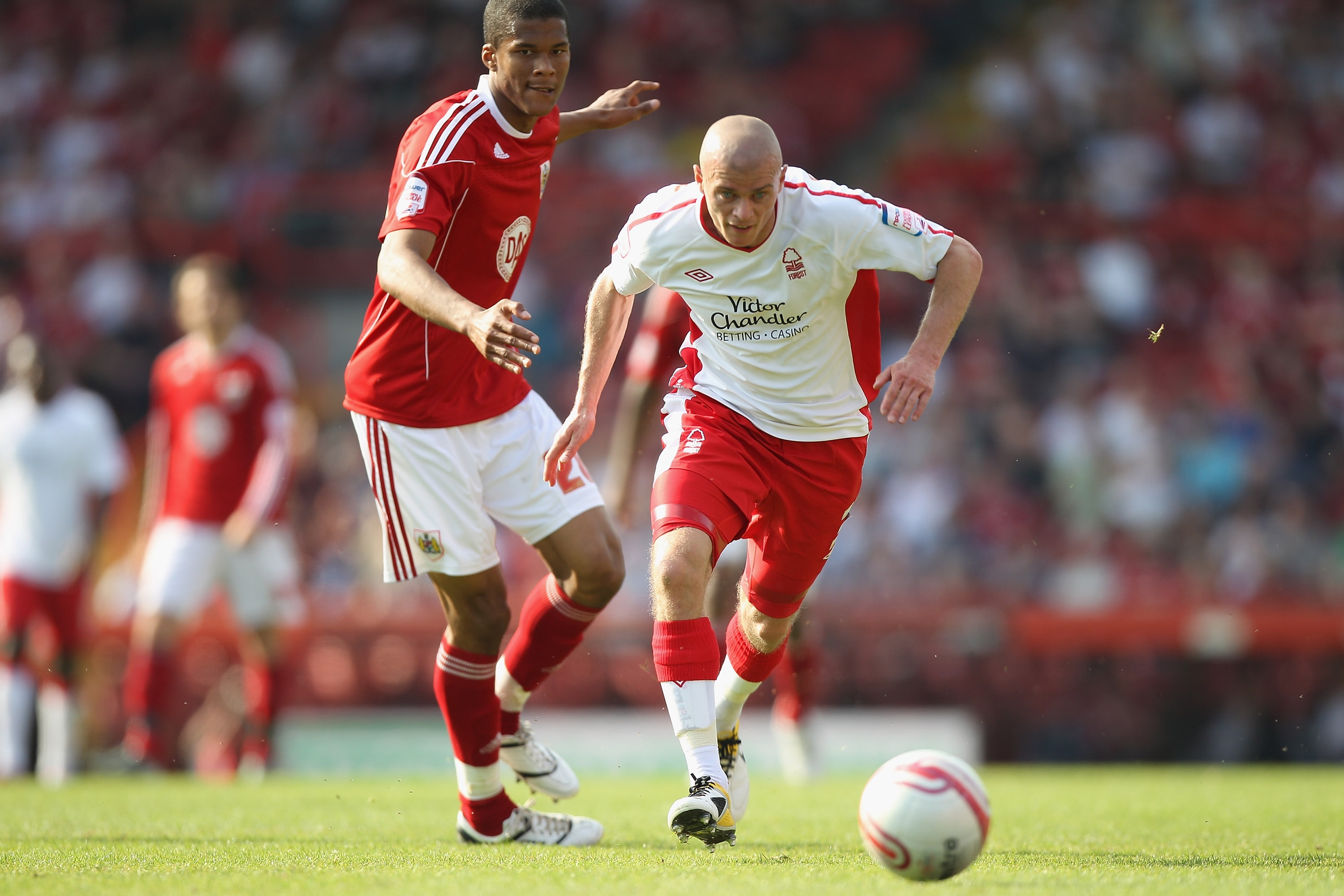 BRISTOL, ENGLAND - APRIL 25:  Paul Konchesky (R) of Forest skips away from Jordan Spence (L) during the npower Championship game between Bristol City and Nottingham Forest at Ashton Gate on April 25, 2011 in Bristol, England.  (Photo by Michael Steele/Get