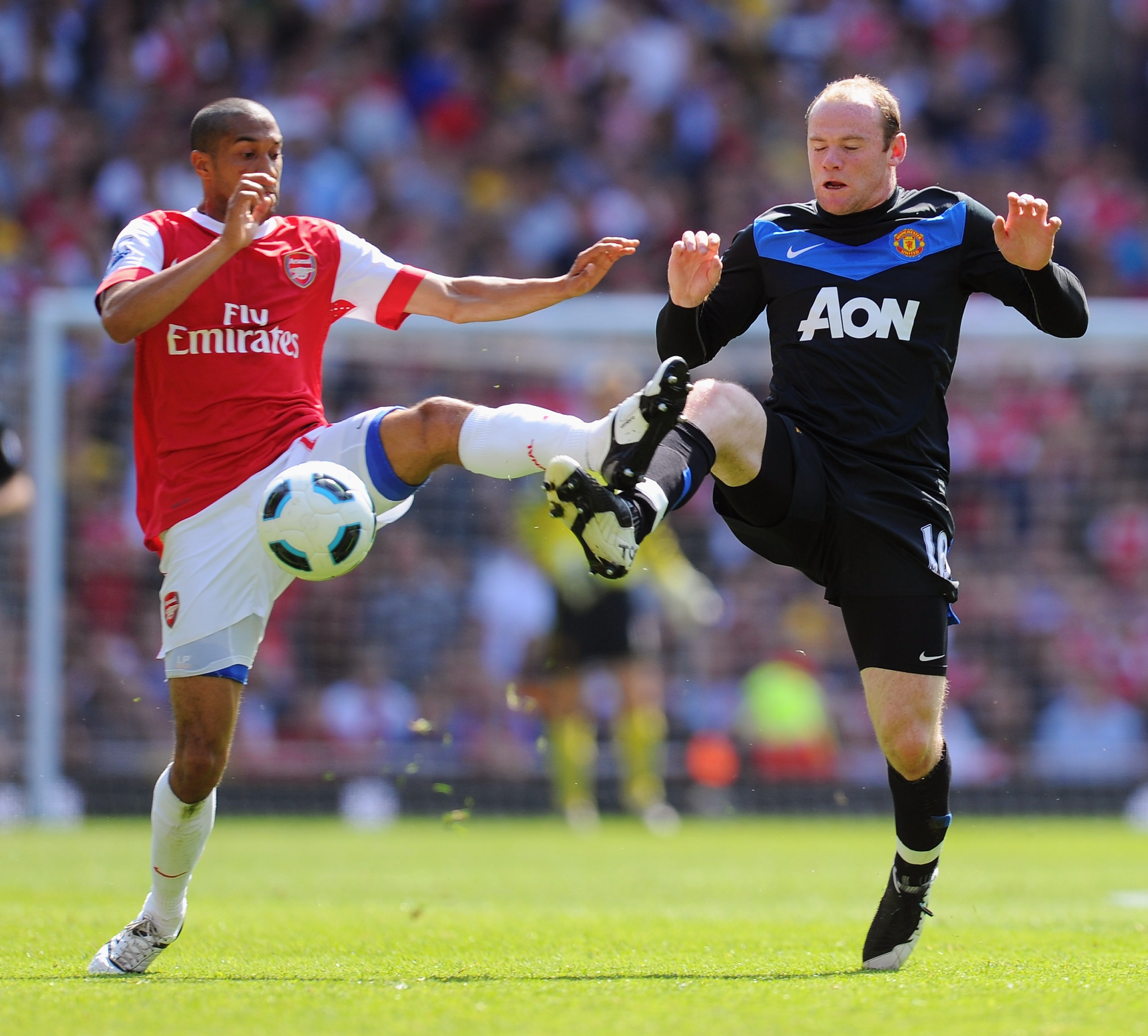 LONDON, ENGLAND - MAY 01:  Gael Clichy of Arsenal battles with Wayne Rooney of Manchester United during the Barclays Premier League match between Arsenal and Manchester United at the Emirates Stadium on May 1, 2011 in London, England.  (Photo by Mike Hewi
