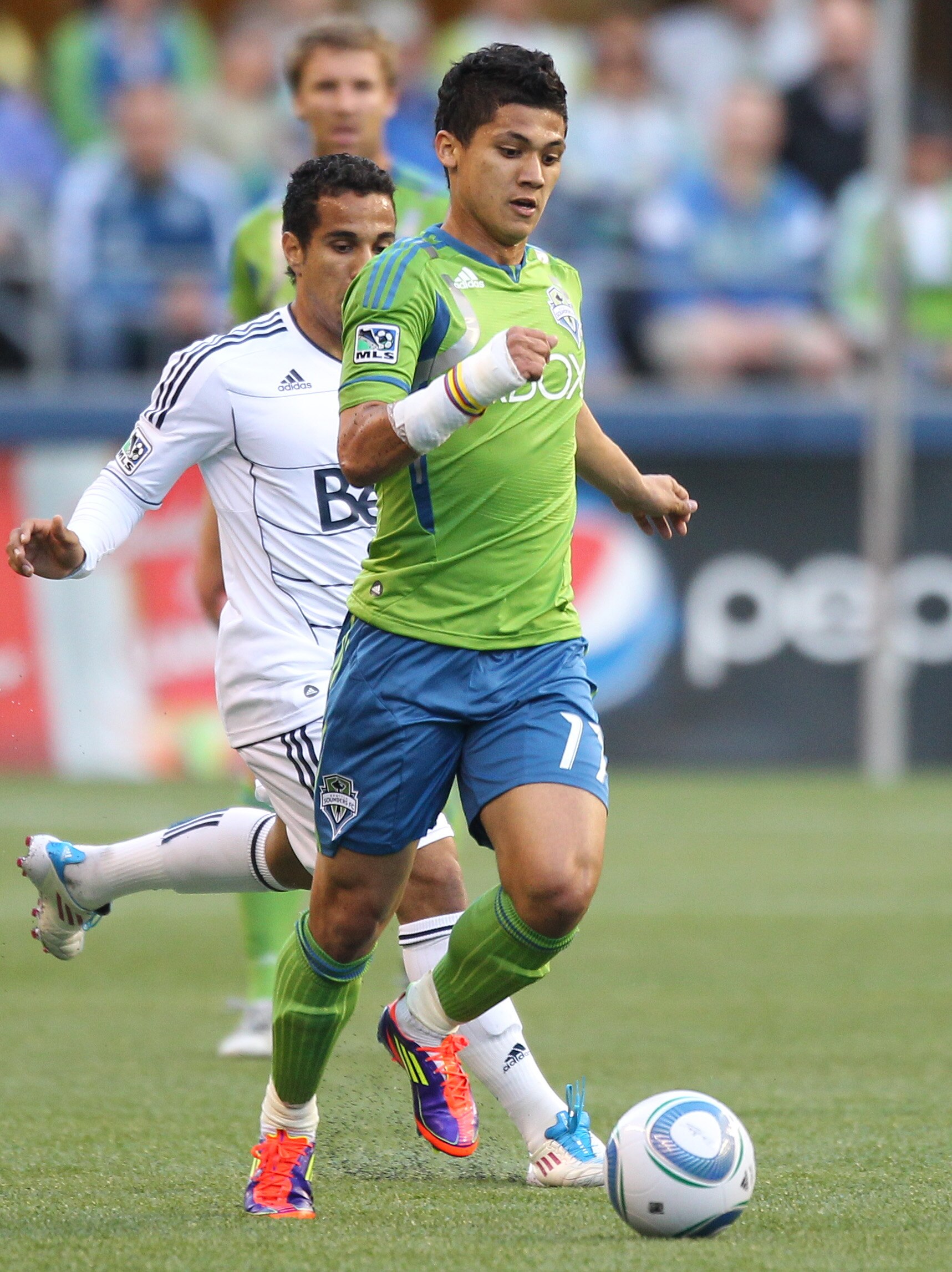 SEATTLE, WA - JUNE 11:  Fredy Montero #17 of the Seattle Sounders FC dribbles against the Vancouver Whitecaps FC at Qwest Field on June 11, 2011 in Seattle, Washington. (Photo by Otto Greule Jr/Getty Images)