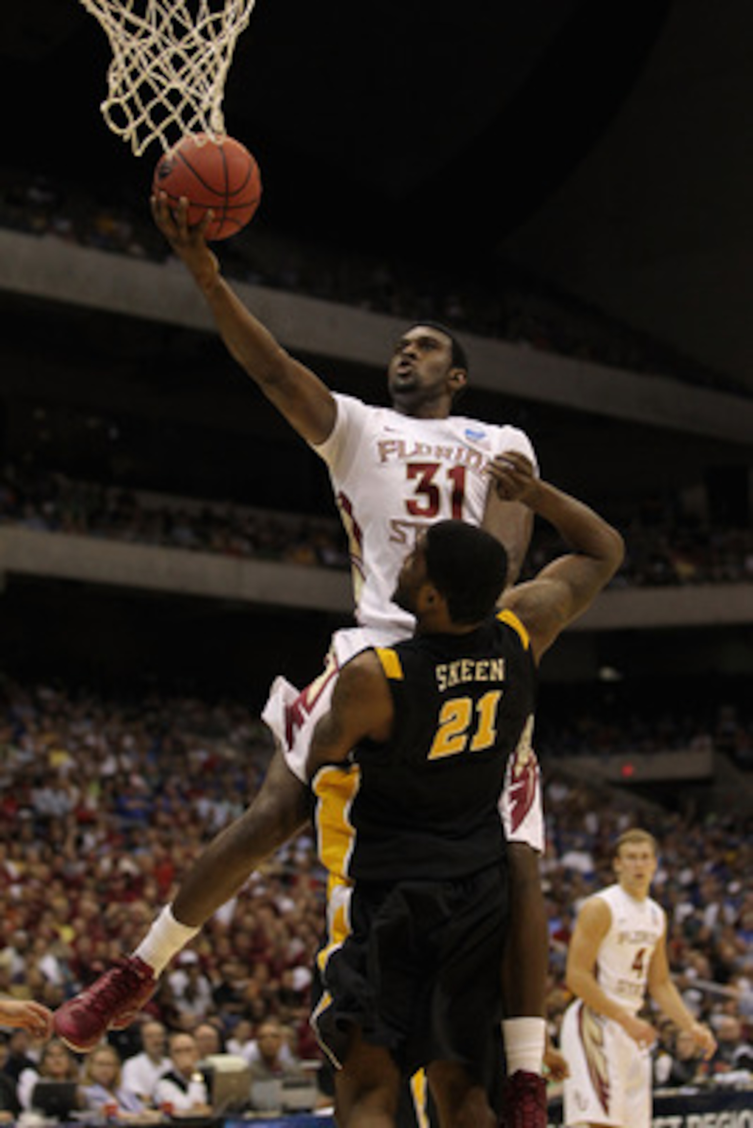 SAN ANTONIO, TX - MARCH 25:  Chris Singleton #31 of the Florida State Seminoles goes to the basket against Jamie Skeen #21 of the Virginia Commonwealth Rams during the southwest regional of the 2011 NCAA men's basketball tournament at the Alamodome on Mar