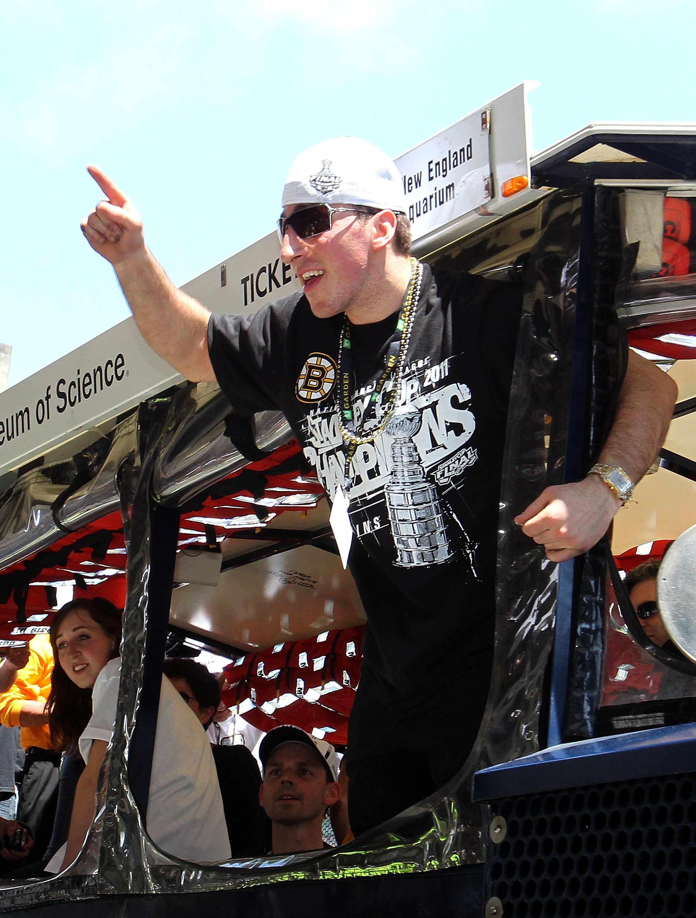 BOSTON, MA  - JUNE 18:  Brad Marchand of the Boston Bruins reacts to cheers during a Stanley Cup victory parade on June 18, 2011 in Boston, Massachusetts.  (Photo by Jim Rogash/Getty Images)