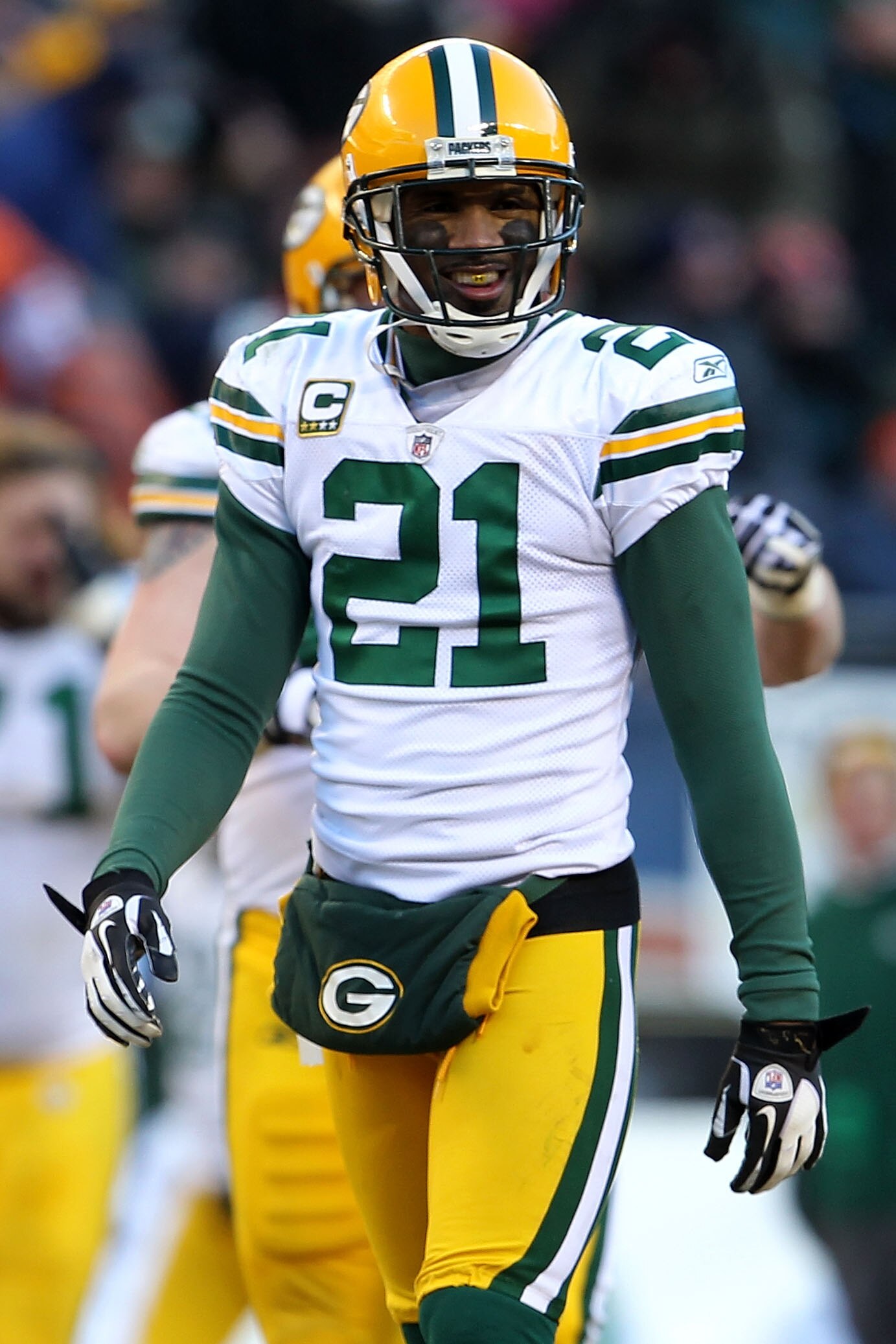 CHICAGO, IL - JANUARY 23:  Charles Woodson #21 of the Green Bay Packers smiles while taking on the Chicago Bears in the NFC Championship Game at Soldier Field on January 23, 2011 in Chicago, Illinois.  (Photo by Jamie Squire/Getty Images)