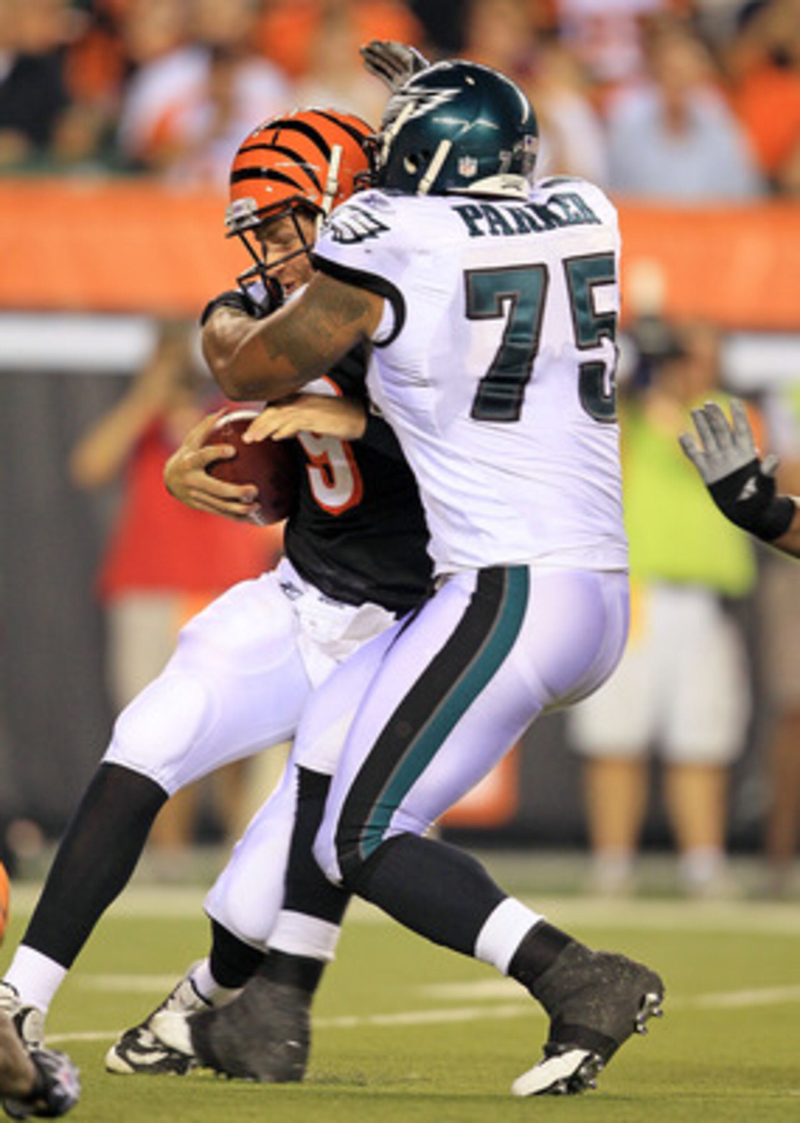 CINCINNATI - AUGUST 20:  Carson Palmer #9 of the Cincinnati Bengals is sacked by Juqua Parker #75 of  the Philadelphia Eagles during the NFL preseason game at Paul Brown Stadium on August 20, 2010 in Cincinnati, Ohio.  (Photo by Andy Lyons/Getty Images)