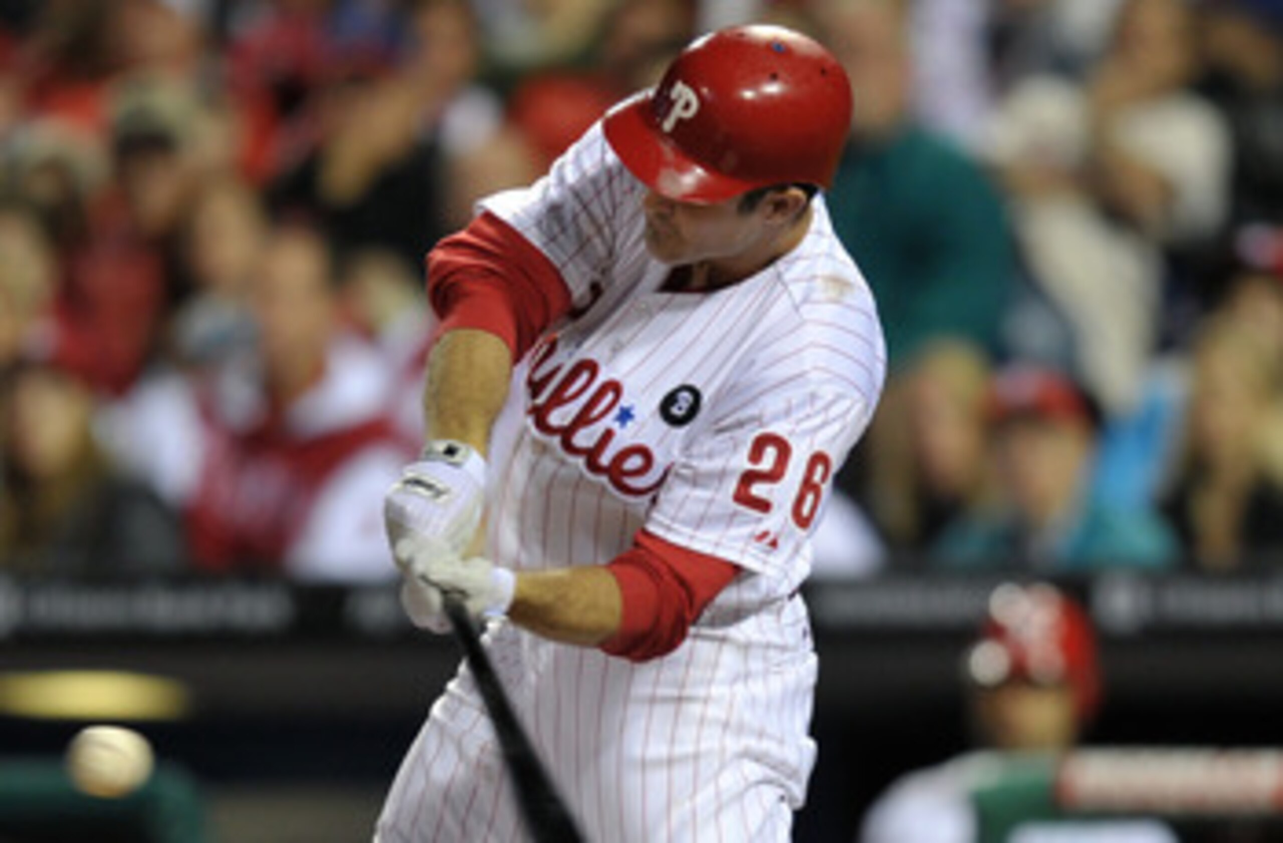 PHILADELPHIA, PA - JUNE 14: Chase Utley #26 of the Philadelphia Phillies hits a two run home-run in the bottom of the third inning during the game against the Florida Marlins at Citizens Bank Park on June 14, 2011 in Philadelphia, Pennsylvania. (Photo by