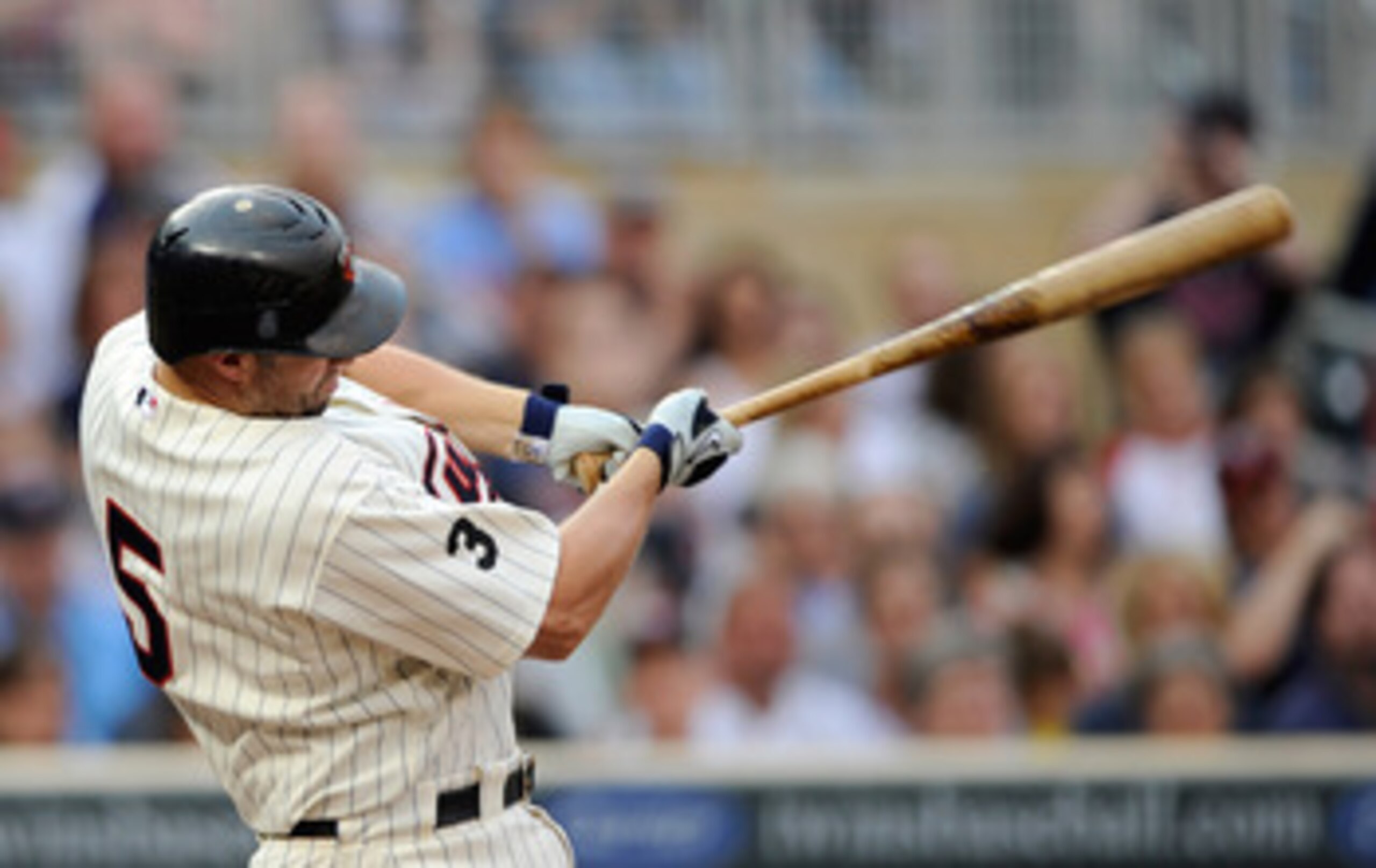 MINNEAPOLIS, MN - JUNE 17: Michael Cuddyer #5 of the Minnesota Twins gets an RBI double against the San Diego Padres in the first inning on June 17, 2011 at Target Field in Minneapolis, Minnesota. (Photo by Hannah Foslien/Getty Images)