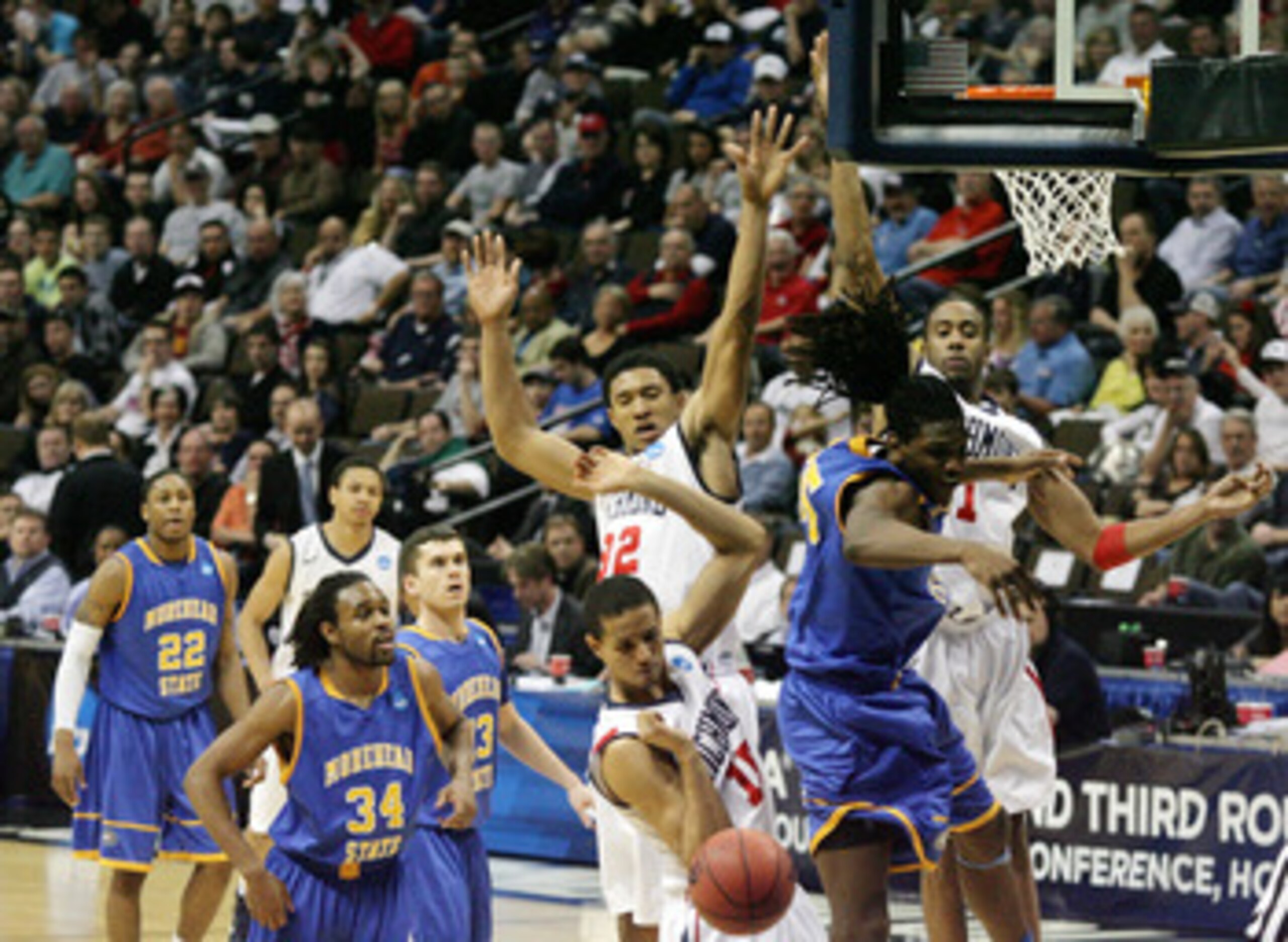DENVER, CO - MARCH 19:  Kenneth Faried #35 of the Morehead State Eagles loses control of the ball while going to the basket against Josh Duinker #11, Justin Harper #32 and Francis-Cedric Martel #15 of the Richmond Spiders during the third round of the 201
