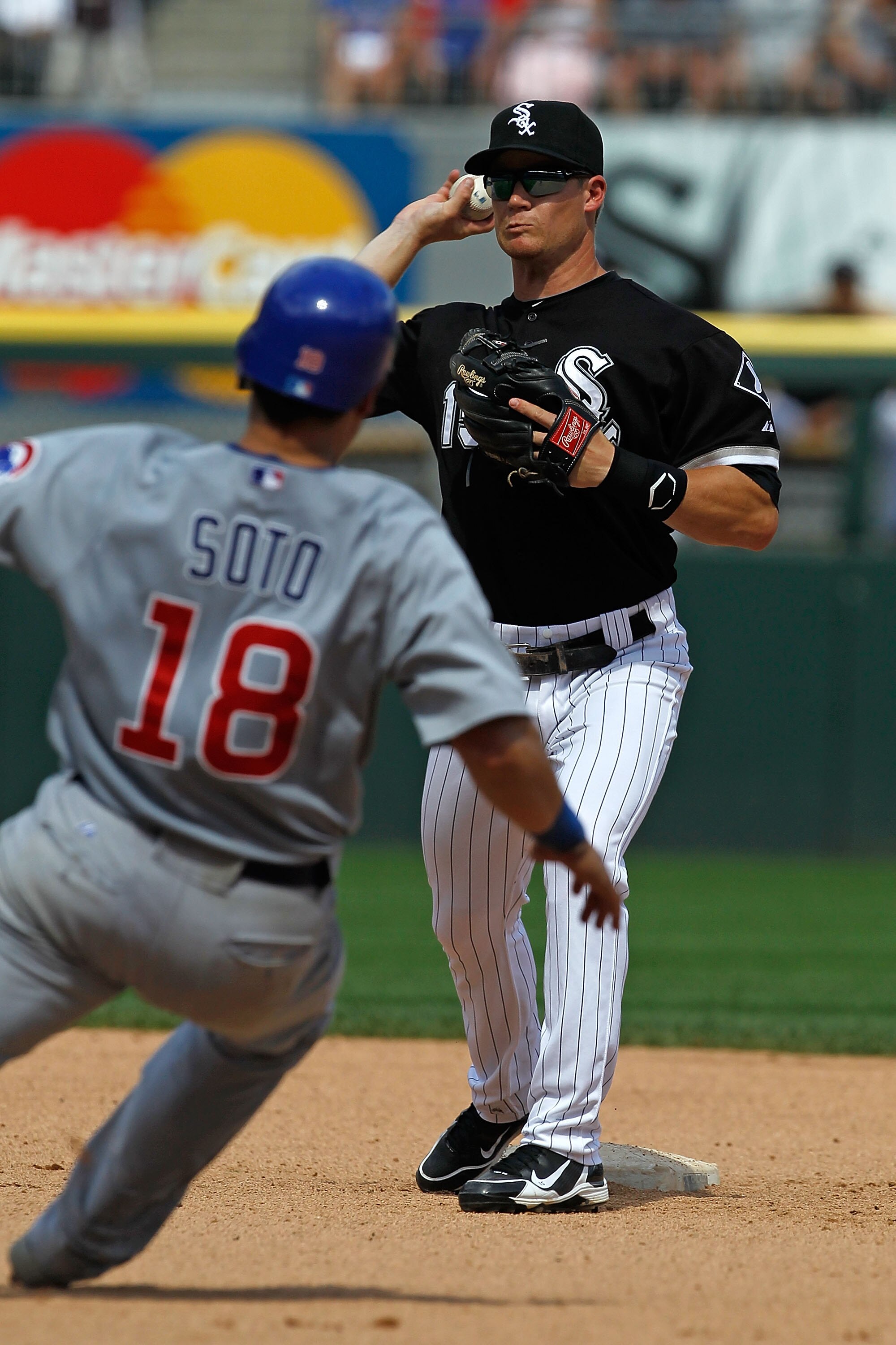 CHICAGO - JUNE 27: Gordon Beckham #15 of the Chicago White Sox turns a double play as Geovany Soto #18 of the Chicago Cubs slides into 2nd base at U.S. Cellular Field on June 27, 2010 in Chicago, Illinois. The Cubs defeated the White Sox 8-6. (Photo by Jo