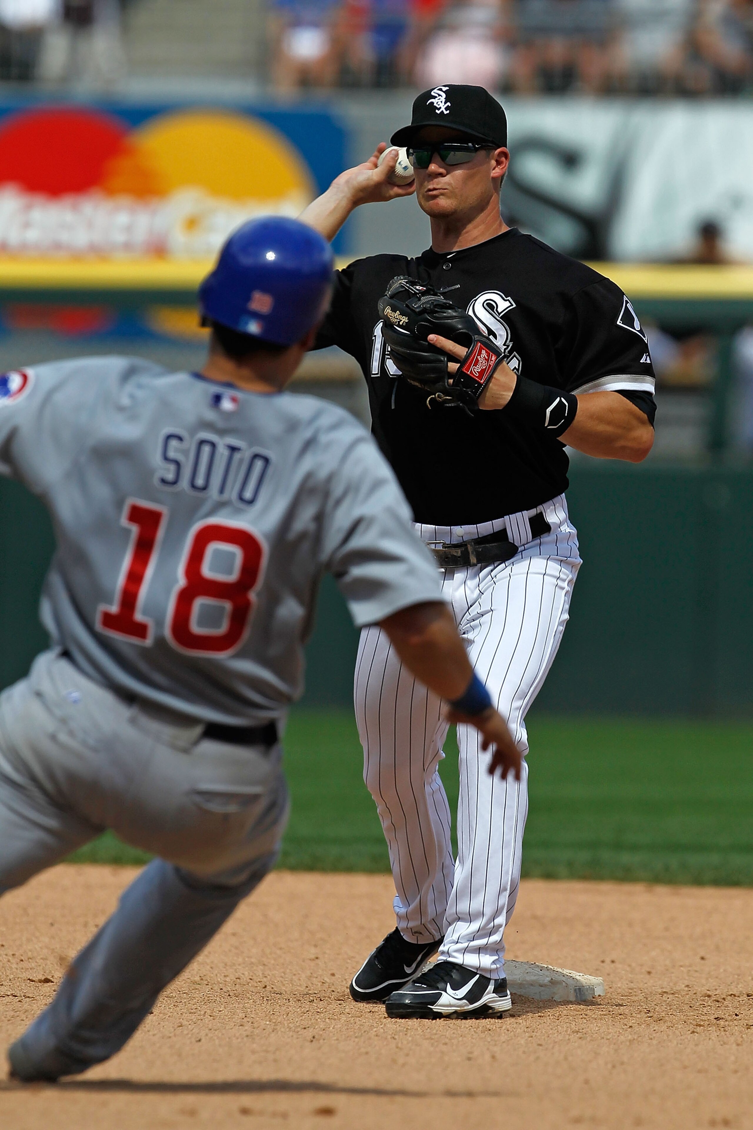CHICAGO - JUNE 27: Gordon Beckham #15 of the Chicago White Sox turns a double play as Geovany Soto #18 of the Chicago Cubs slides into 2nd base at U.S. Cellular Field on June 27, 2010 in Chicago, Illinois. The Cubs defeated the White Sox 8-6. (Photo by Jo