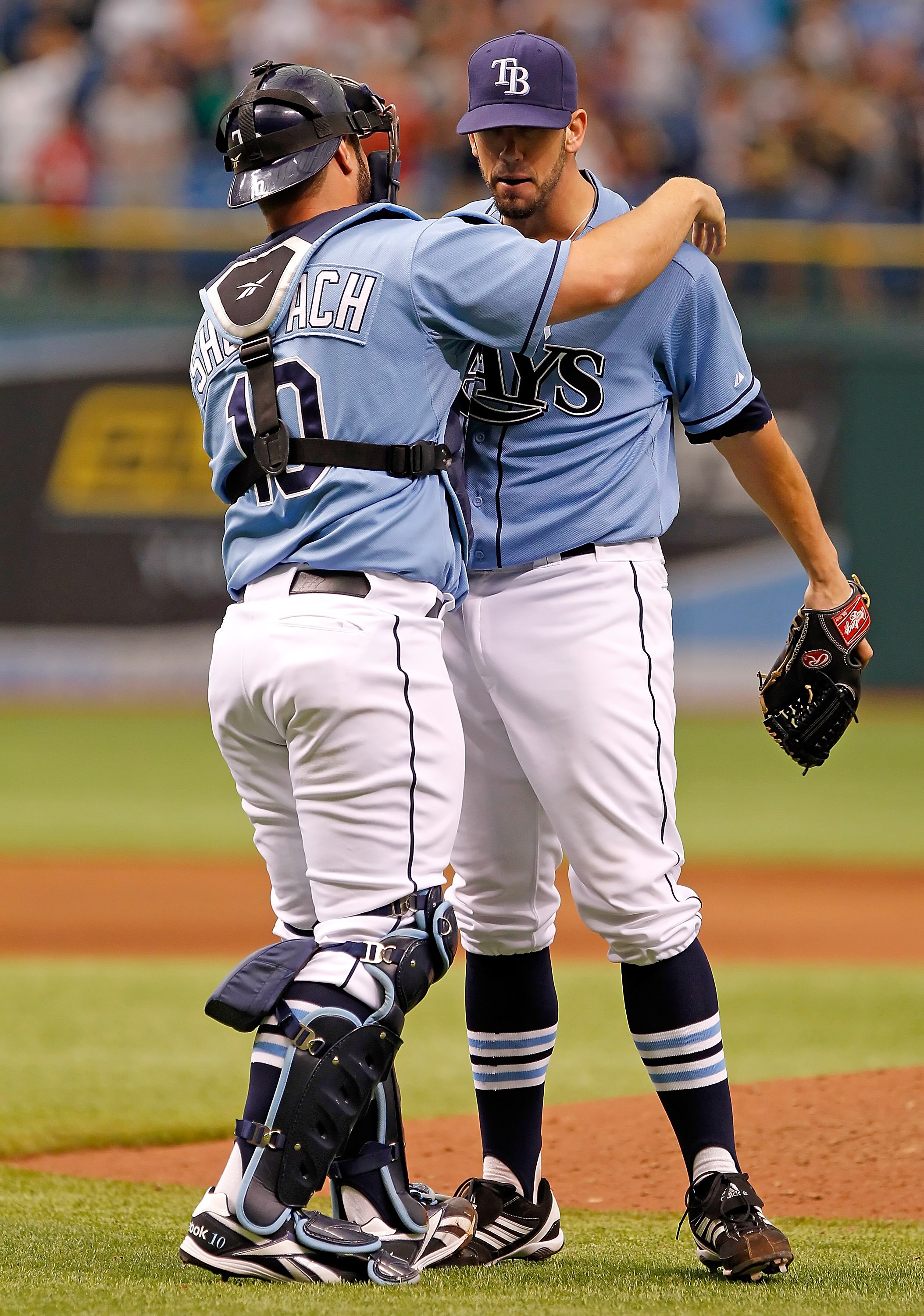 ST. PETERSBURG, FL - JUNE 19:  Catcher Kelly Shoppach #10 hugs pitcher James Shields #33 of the Tampa Bay Rays after his complete game victory over the Florida Marlins at Tropicana Field on June 19, 2011 in St. Petersburg, Florida.  (Photo by J. Meric/Get