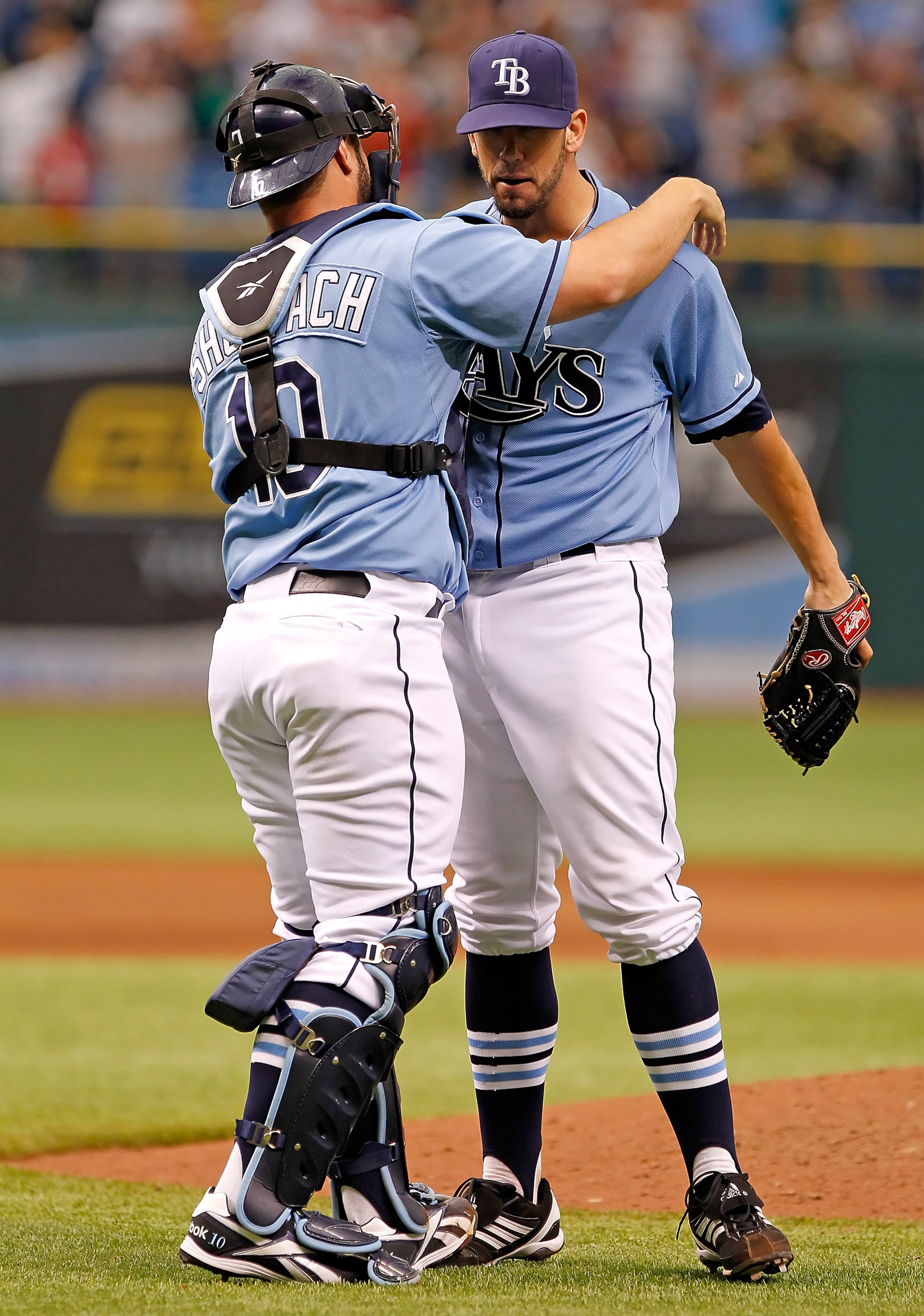 ST. PETERSBURG, FL - JUNE 19:  Catcher Kelly Shoppach #10 hugs pitcher James Shields #33 of the Tampa Bay Rays after his complete game victory over the Florida Marlins at Tropicana Field on June 19, 2011 in St. Petersburg, Florida.  (Photo by J. Meric/Get