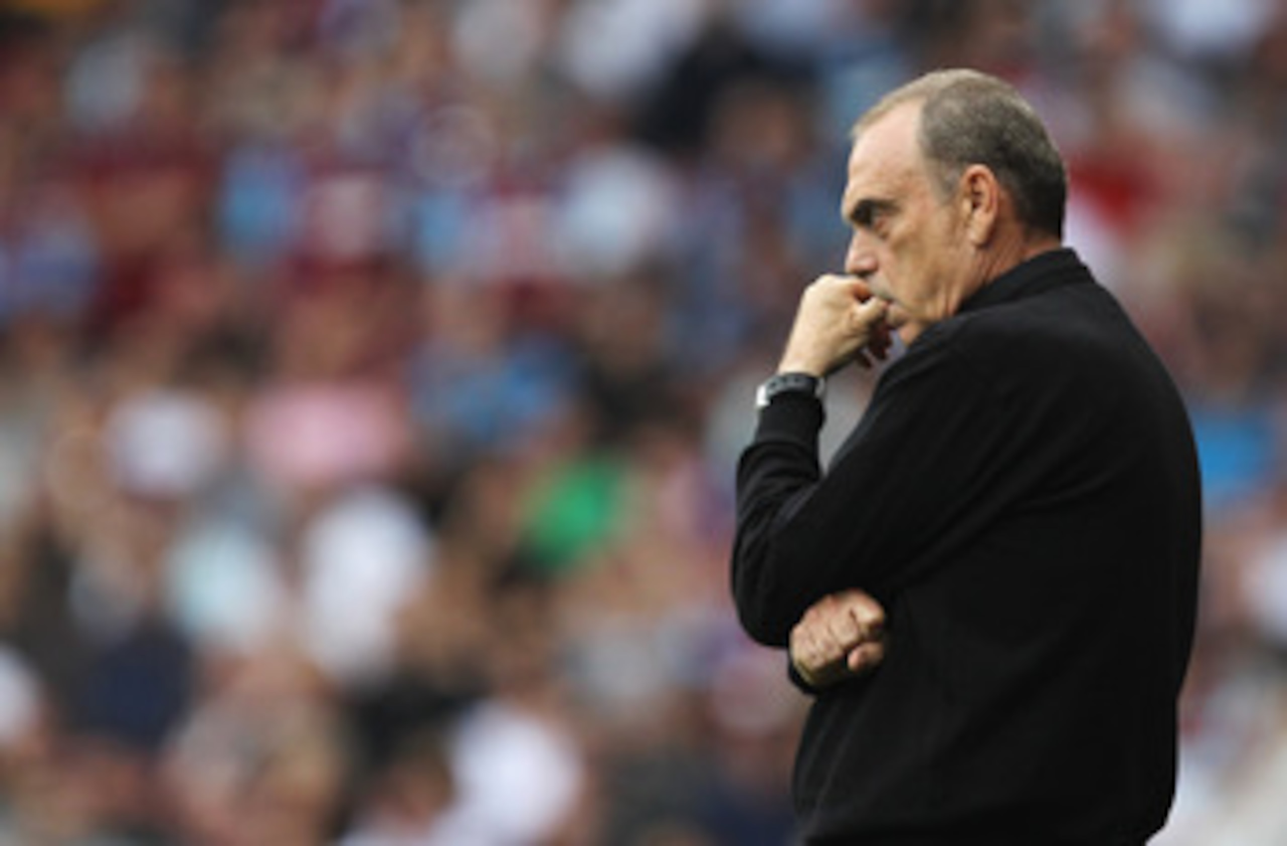 LONDON, ENGLAND - SEPTEMBER 11:  Avram Grant manager of West Ham United looks thoughtful during the Barclays Premier League match between West Ham United and Chelsea at the Boleyn Ground on September 11, 2010 in London, England.  (Photo by Hamish Blair/Ge