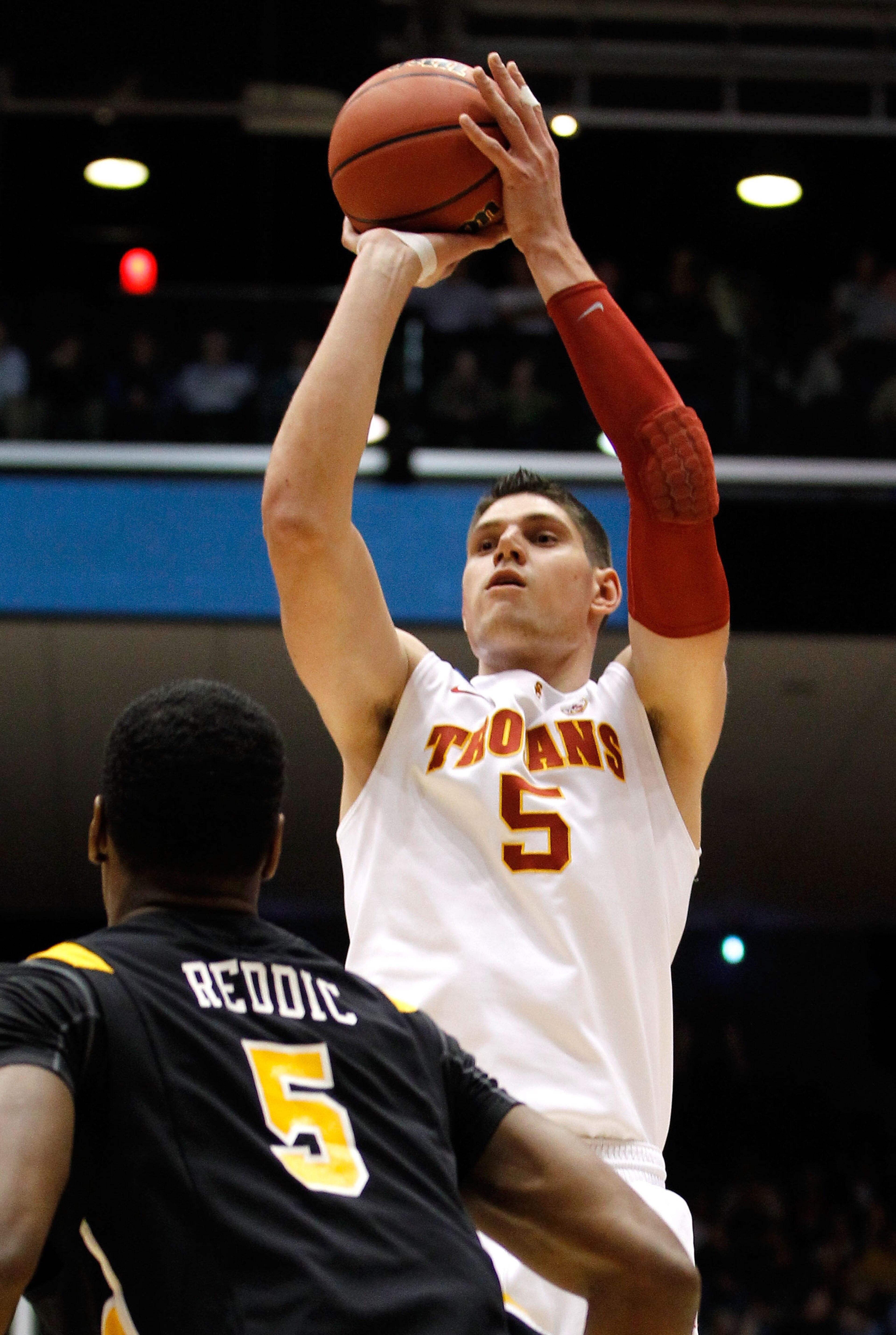 DAYTON, OH - MARCH 16: Nikola Vucevic #5 of the USC Trojans shoots over Juvonte Reddic #5 of the Virginia Commonwealth Rams during the first round of the 2011 NCAA men's basketball tournament at UD Arena on March 16, 2011 in Dayton, Ohio. (Photo by Grego DAYTON, OH - MARCH 16: Nikola Vucevic #5 of the USC Trojans shoots over Juvonte Reddic #5 of the Virginia Commonwealth Rams during the first round of the 2011 NCAA men's basketball tournament at UD Arena on March 16, 2011 in Dayton, Ohio. (Photo by Grego
