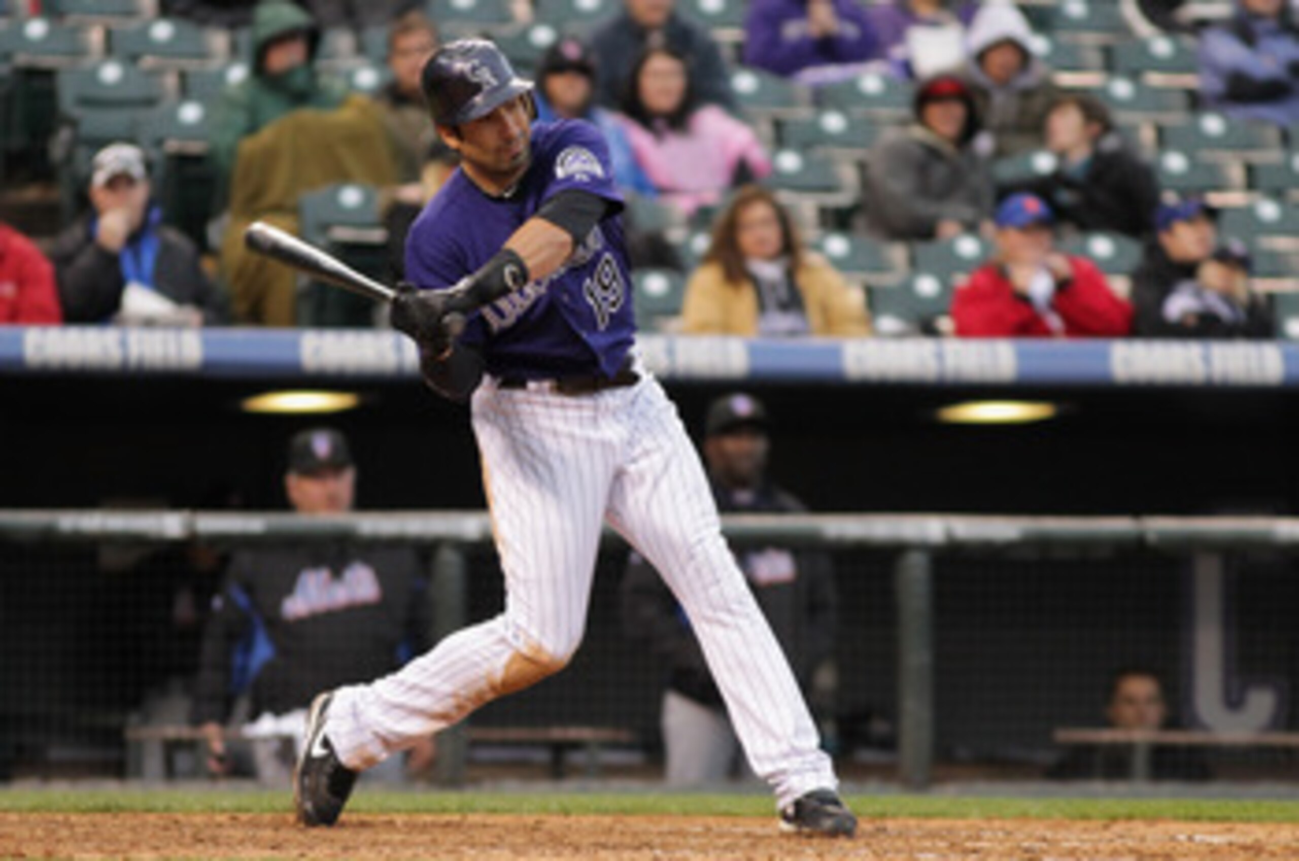 DENVER, CO - MAY 12:  Ryan Spilborghs #19 of the Colorado Rockies takes an at bat New York Mets at Coors Field on May 12, 2011 in Denver, Colorado.  (Photo by Doug Pensinger/Getty Images)