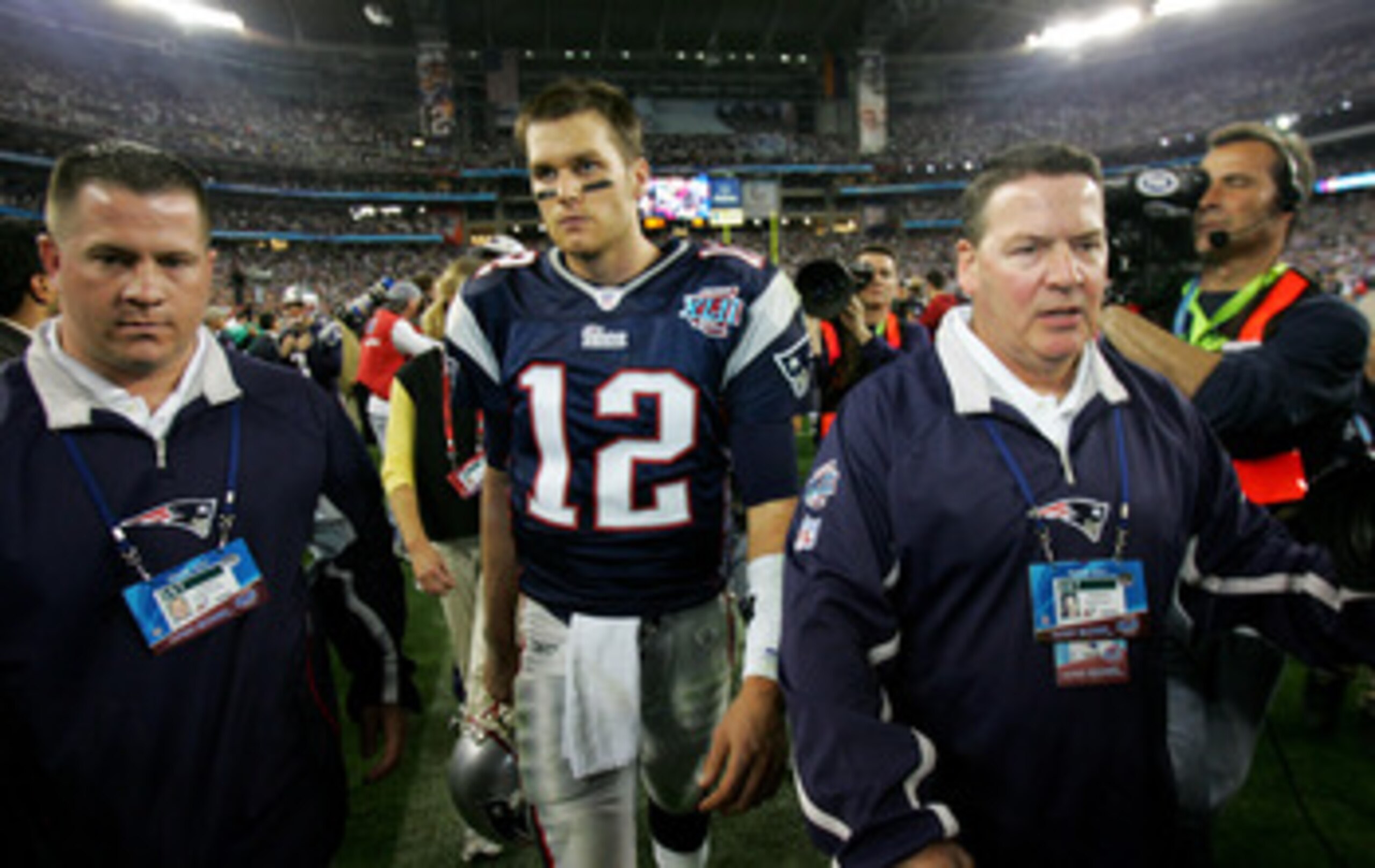 GLENDALE, AZ - FEBRUARY 03:  Tom Brady #12 of the New England Patriots walks off the field after losing to the New York Giants 17-14 in Super Bowl XLII on February 3, 2008 at the University of Phoenix Stadium in Glendale, Arizona.  (Photo by Streeter Leck