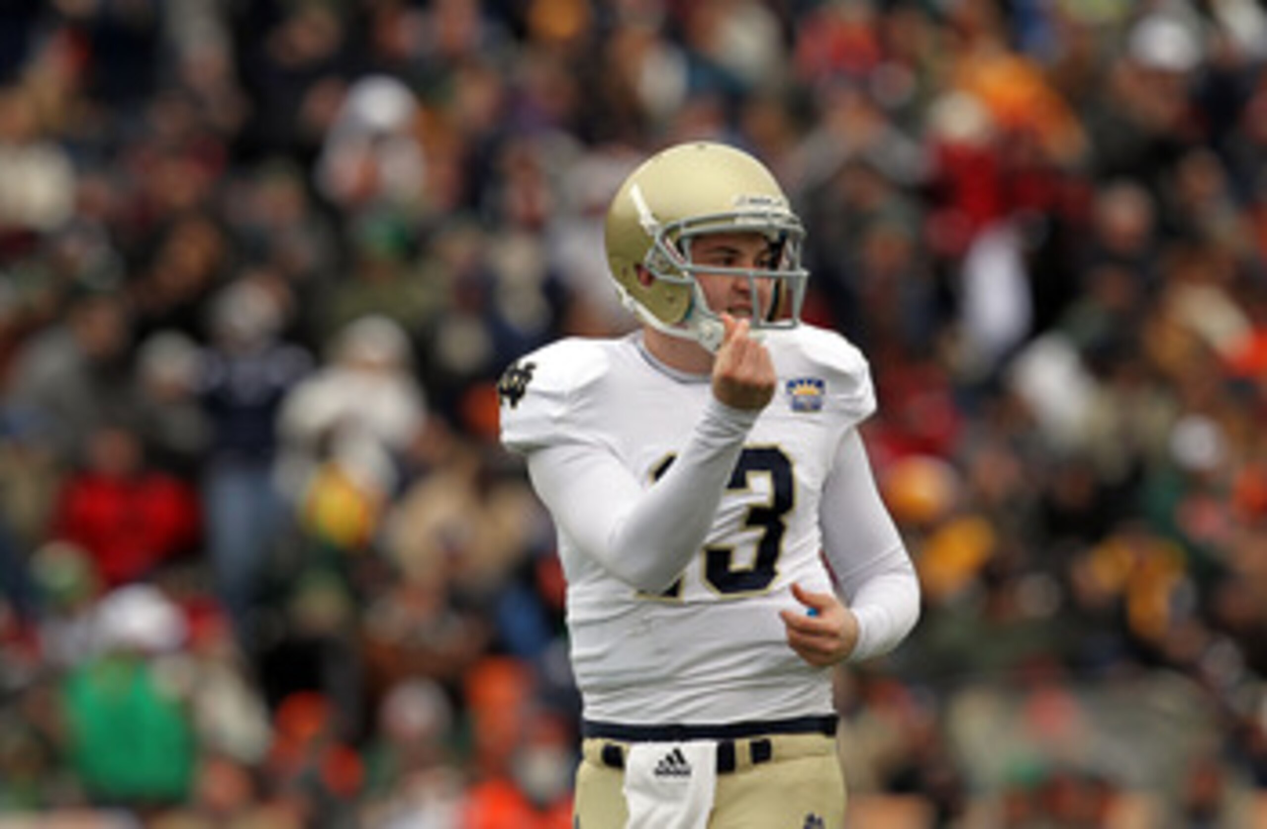 EL PASO, TX - DECEMBER 30:  Quarterback Tommy Rees #13 of the Notre Dame Fighting Irish celebrates a touchdown against the Miami Hurricanes at Sun Bowl on December 30, 2010 in El Paso, Texas.  (Photo by Ronald Martinez/Getty Images)