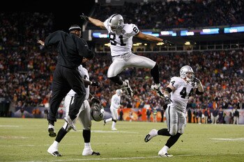 DENVER - DECEMBER 20:  Chaz Schilens #81 of the Oakland Raiders is congratulated by Javon Walker (L) after scoring a touchdown late in the fourth quarter against the Denver Broncos at Invesco Field at Mile High on December 20, 2009 in Denver, Colorado. Th