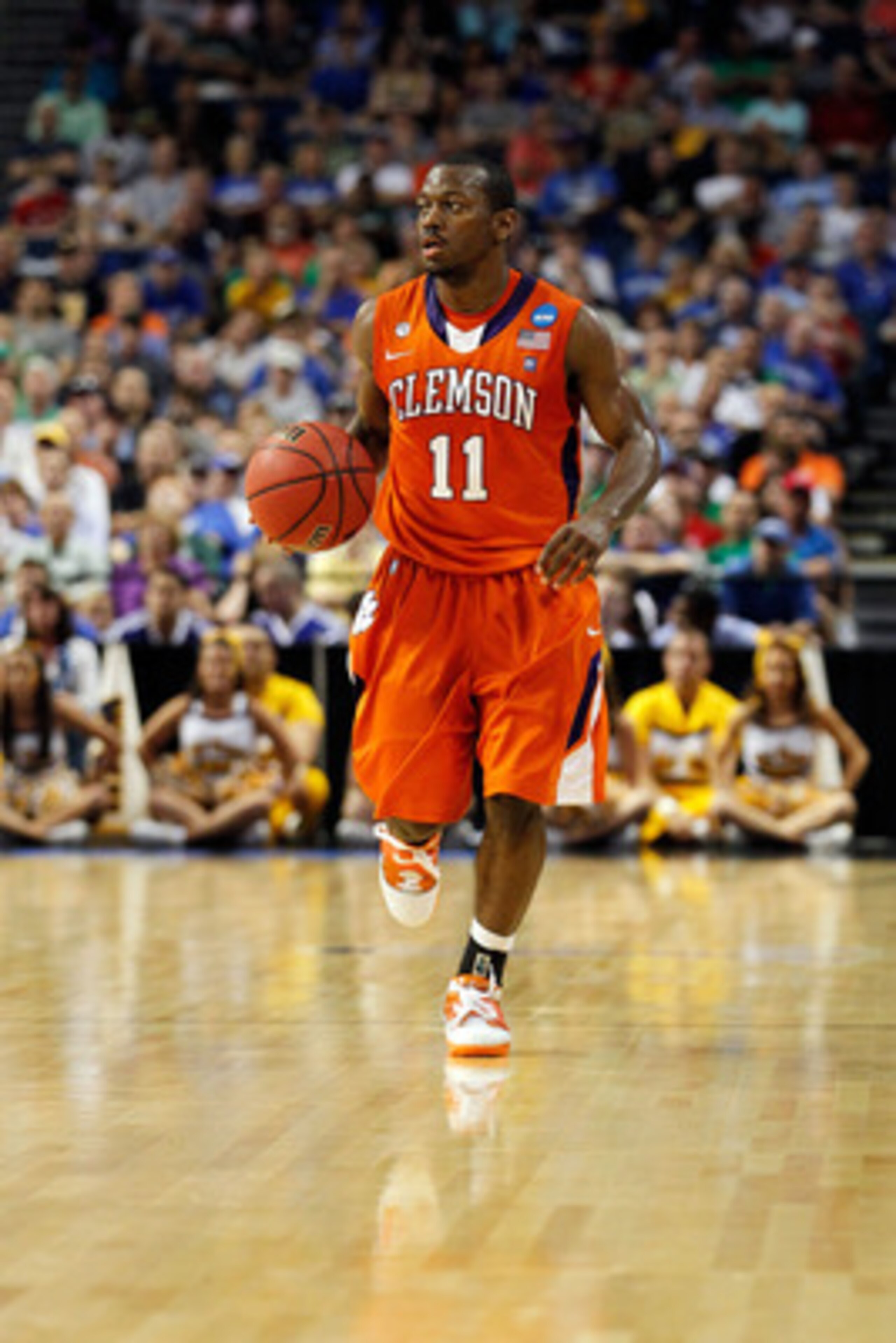 TAMPA, FL - MARCH 17:  Andre Young #11 of the Clemson Tigers brings the ball up court against the West Virginia Mountaineers during the second round of the 2011 NCAA men's basketball tournament at St. Pete Times Forum on March 17, 2011 in Tampa, Florida. 