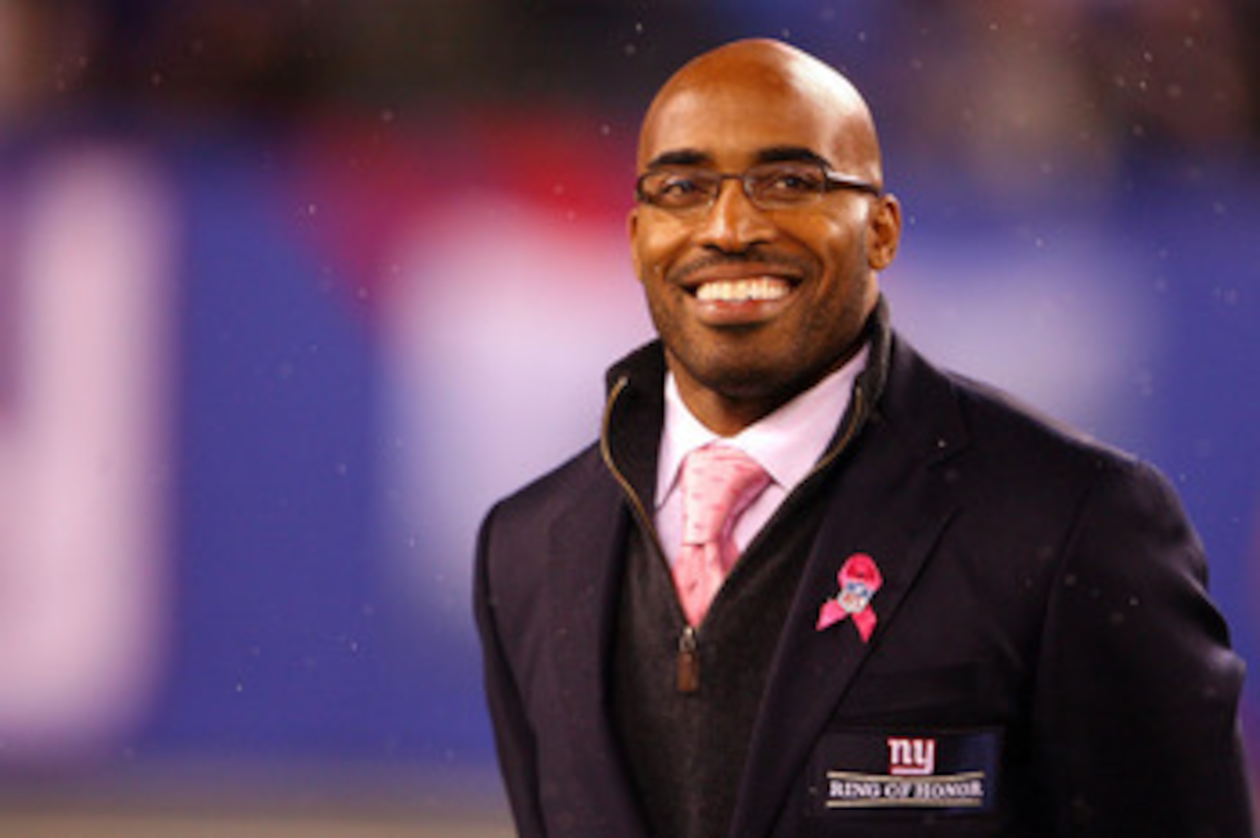 EAST RUTHERFORD, NJ - OCTOBER 03:  Former New York Giants Tiki Barber is inducted into the Giants ï¿½Ring of Honorï¿½ during halftime of a game between the Chicago Bears and the New York Giants at New Meadowlands Stadium on October 3, 2010 in East Rutherford,