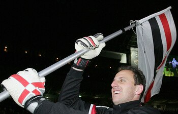 YOKOHAMA, JAPAN - DECEMBER 18:  Ceni Rogerio the Sao Paulo captain celebrates their victory after playing at the FIFA Club World Championship Toyota Cup 2005 final between Sao Paulo FC and Liverpool FC at Yokohama International Stadium on December 18, 200