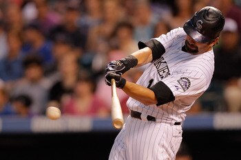 DENVER, CO - JUNE 14:  Todd Helton #17 of the Colorado Rockies singles to center field off of Wade LeBlanc of the San Diego Padres in the sixth inning at Coors Field on June 14, 2011 in Denver, Colorado. (Photo by Justin Edmonds/Getty Images)