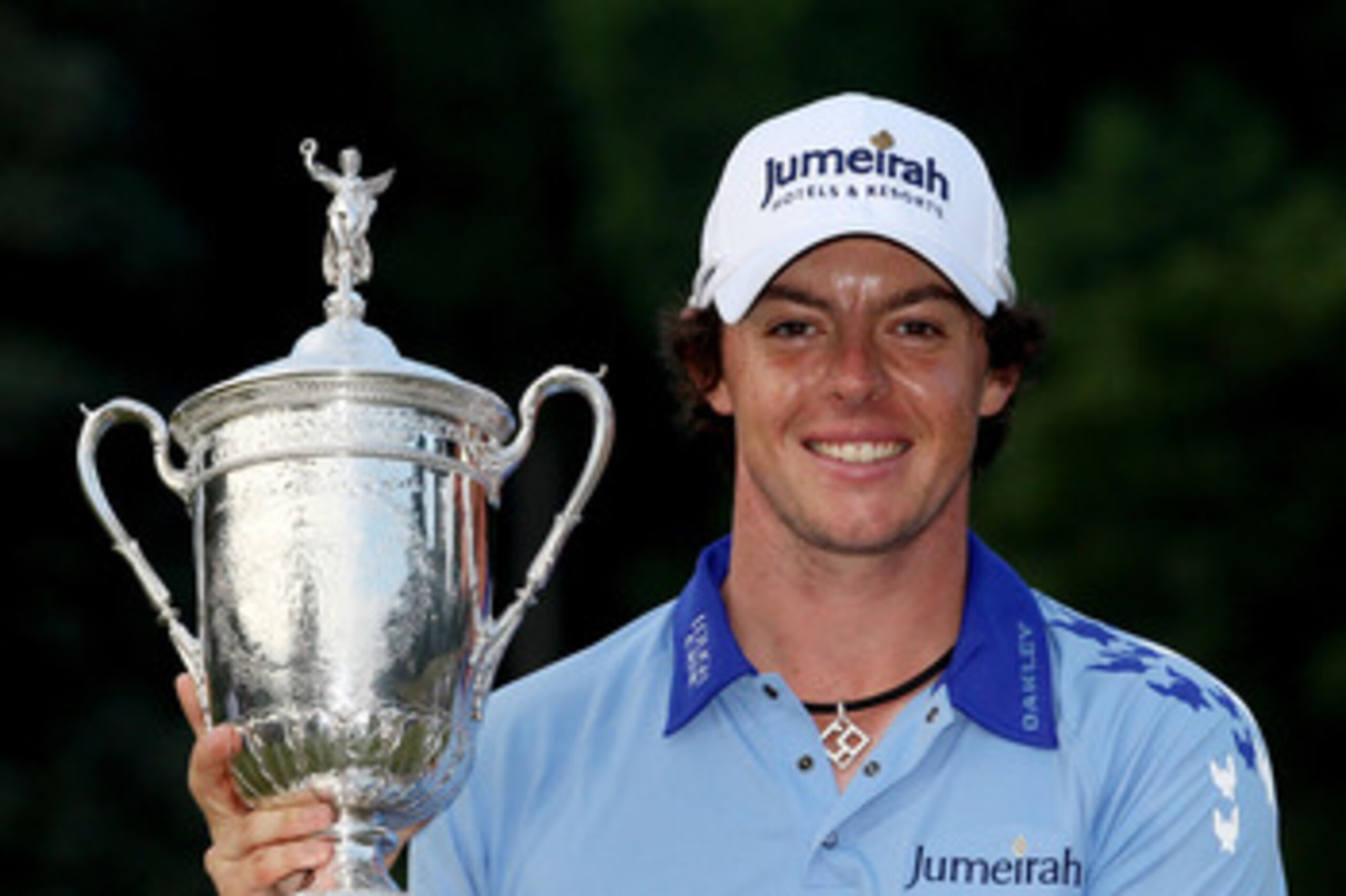 BETHESDA, MD - JUNE 19:  Rory McIlroy of Northern Ireland poses with the trophy after his eight-stroke victory on the 18th green during the 111th U.S. Open at Congressional Country Club on June 19, 2011 in Bethesda, Maryland.  (Photo by Andrew Redington/G