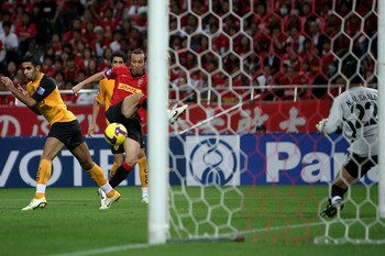 SAITAMA, JAPAN - SEPTEMBER 24:  Marcus Tulio Tanaka of Urawa Red Diamonds scores a goal against Al Qadsia during the Asia Champions League quarter final 2nd leg match between Urawa Red Diamonds and Al Qadsia at Saitama Stadium on September 24, 2008 in Sai
